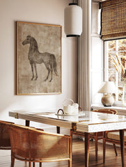 Sepia sketch of a horse standing in profile on a textured beige background, vintage illustrative, in a styled room mockup