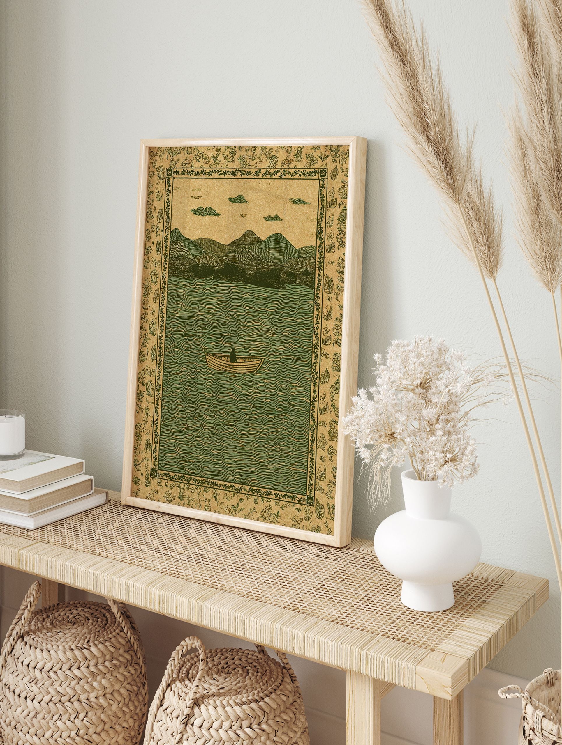 Vintage lake landscape illustration with a person in a boat, mountains, and a botanical border in green and brown. - Image 3