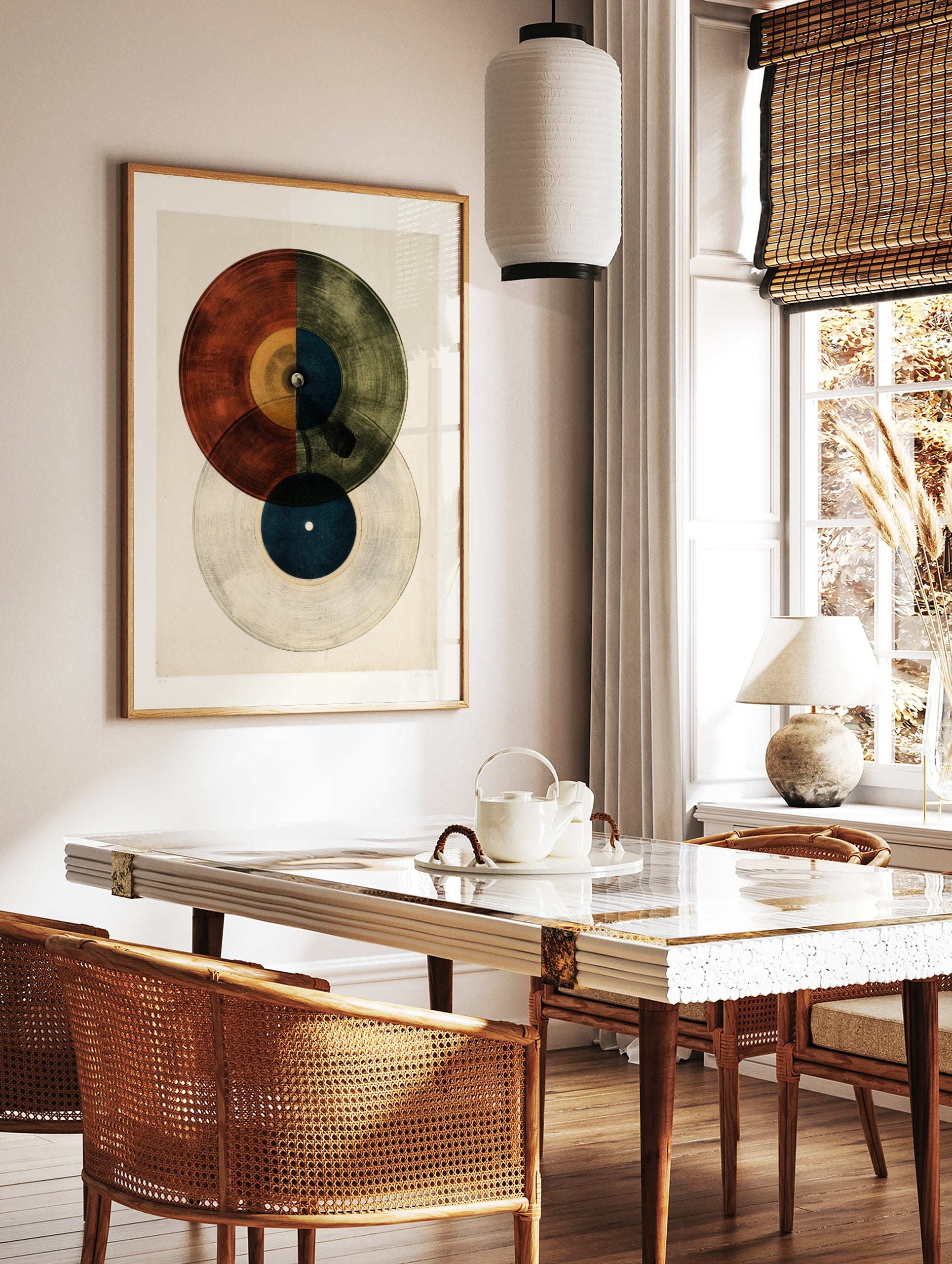 Minimalist vinyl record wall art print with vibrant red, yellow, blue and green geometric sections, in a styled room mockup