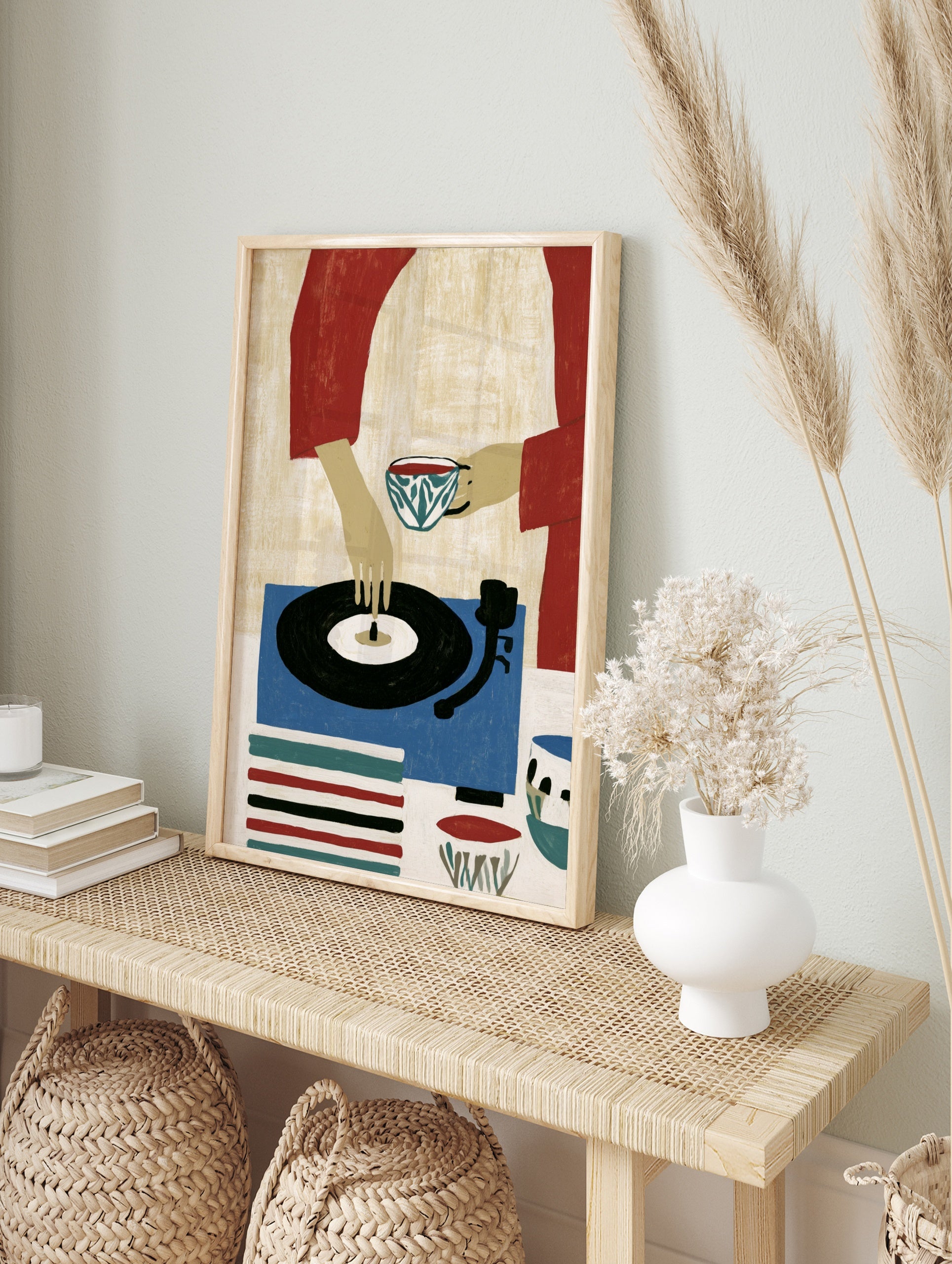 Illustrative art print of a person holding a tea cup and touching a vinyl record on a blue, in an alternate framed mockup