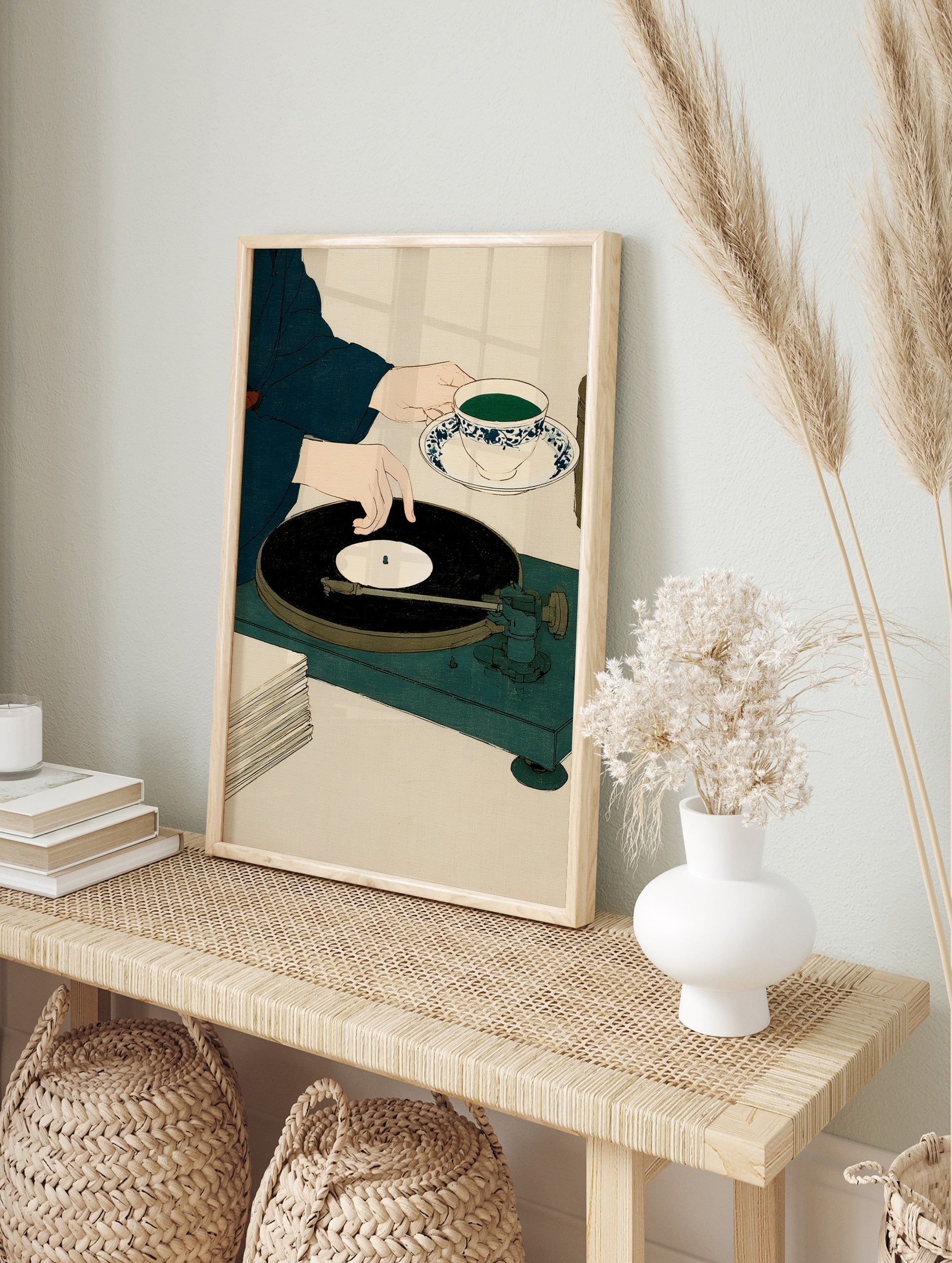 Minimalist illustration of a person handling a vinyl record on a turntable while holding a, in an alternate framed mockup