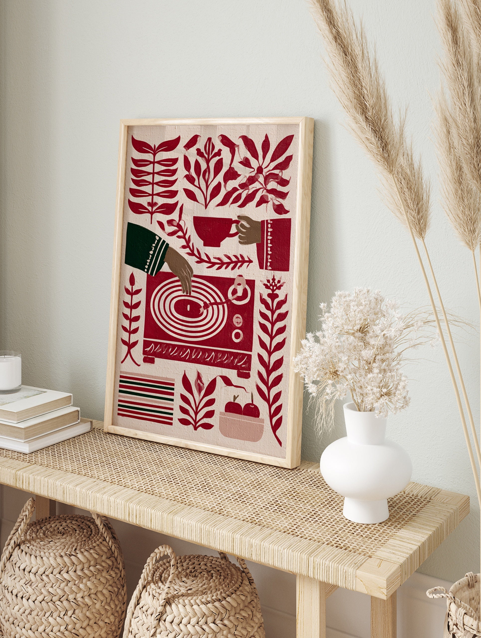 Stylised red and cream illustration of a hand playing a vinyl record, surrounded by botanical, in an alternate framed mockup