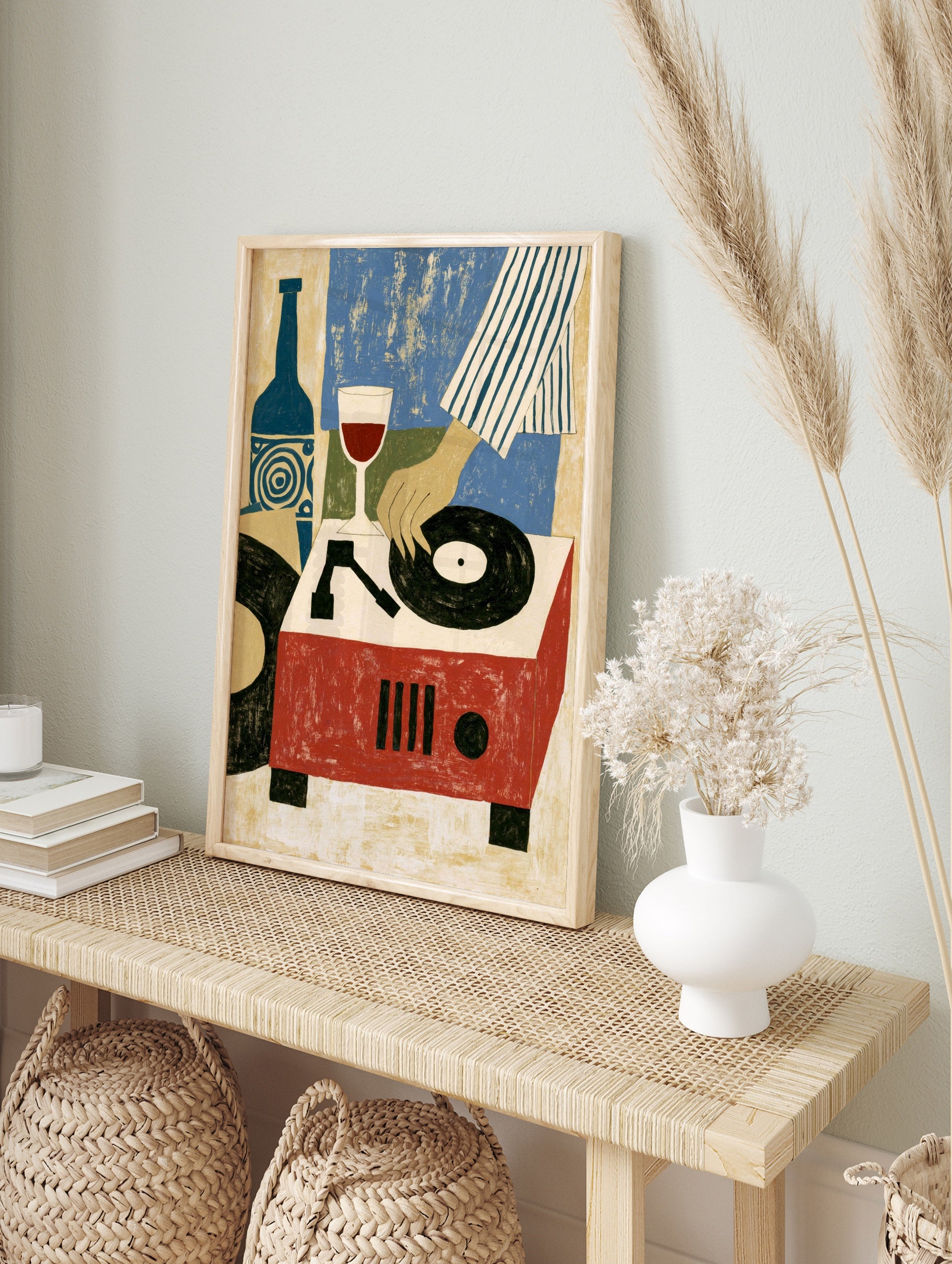 Illustrative art print of a hand playing a vinyl record on a red turntable next to a wine, in an alternate framed mockup