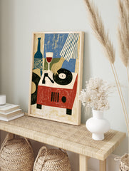Illustrative art print of a hand playing a vinyl record on a red turntable next to a wine, in an alternate framed mockup