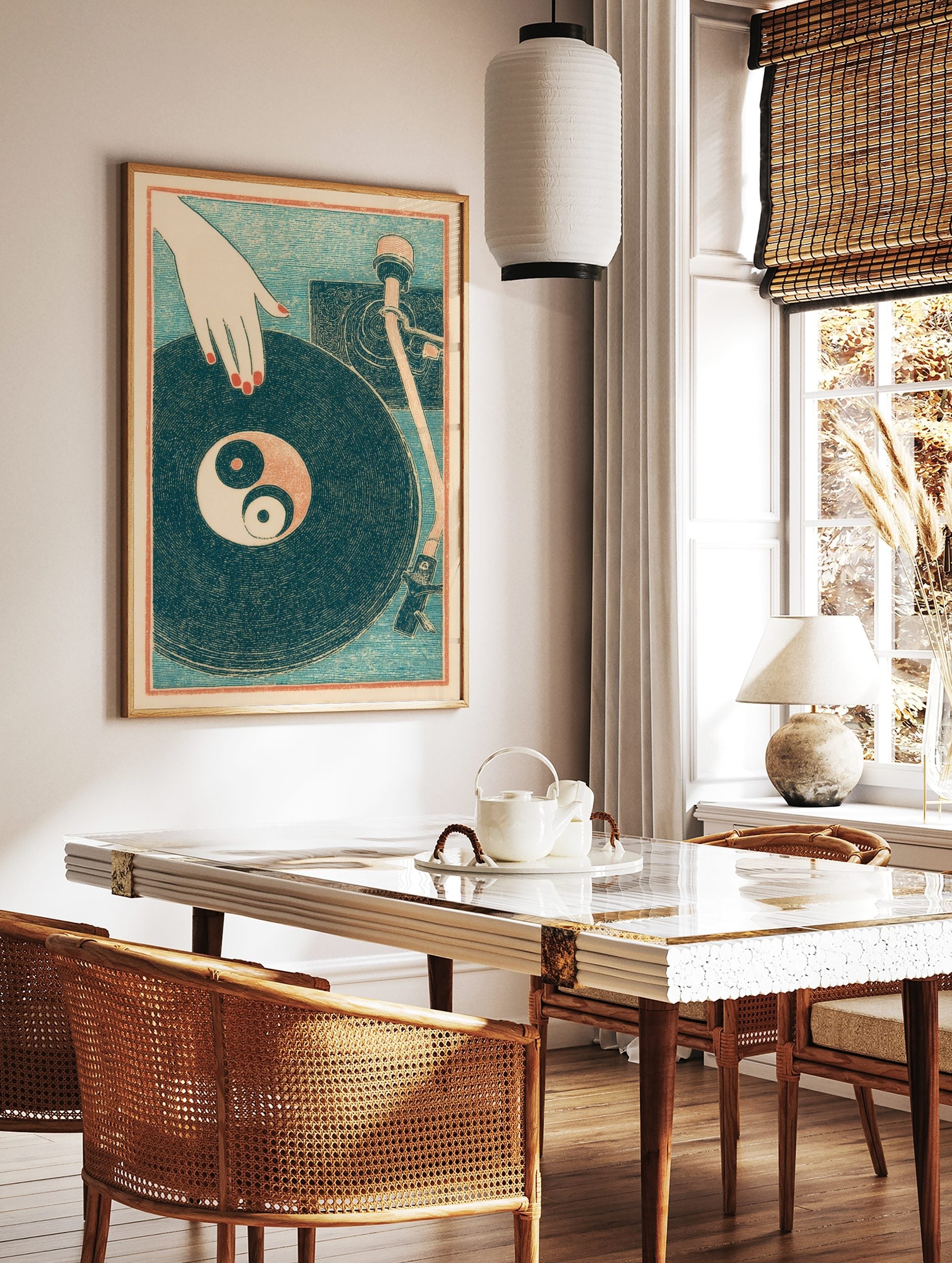 Illustrative print of a hand with red nails on a vinyl record with a Yin Yang symbol, turntable, in a styled room mockup