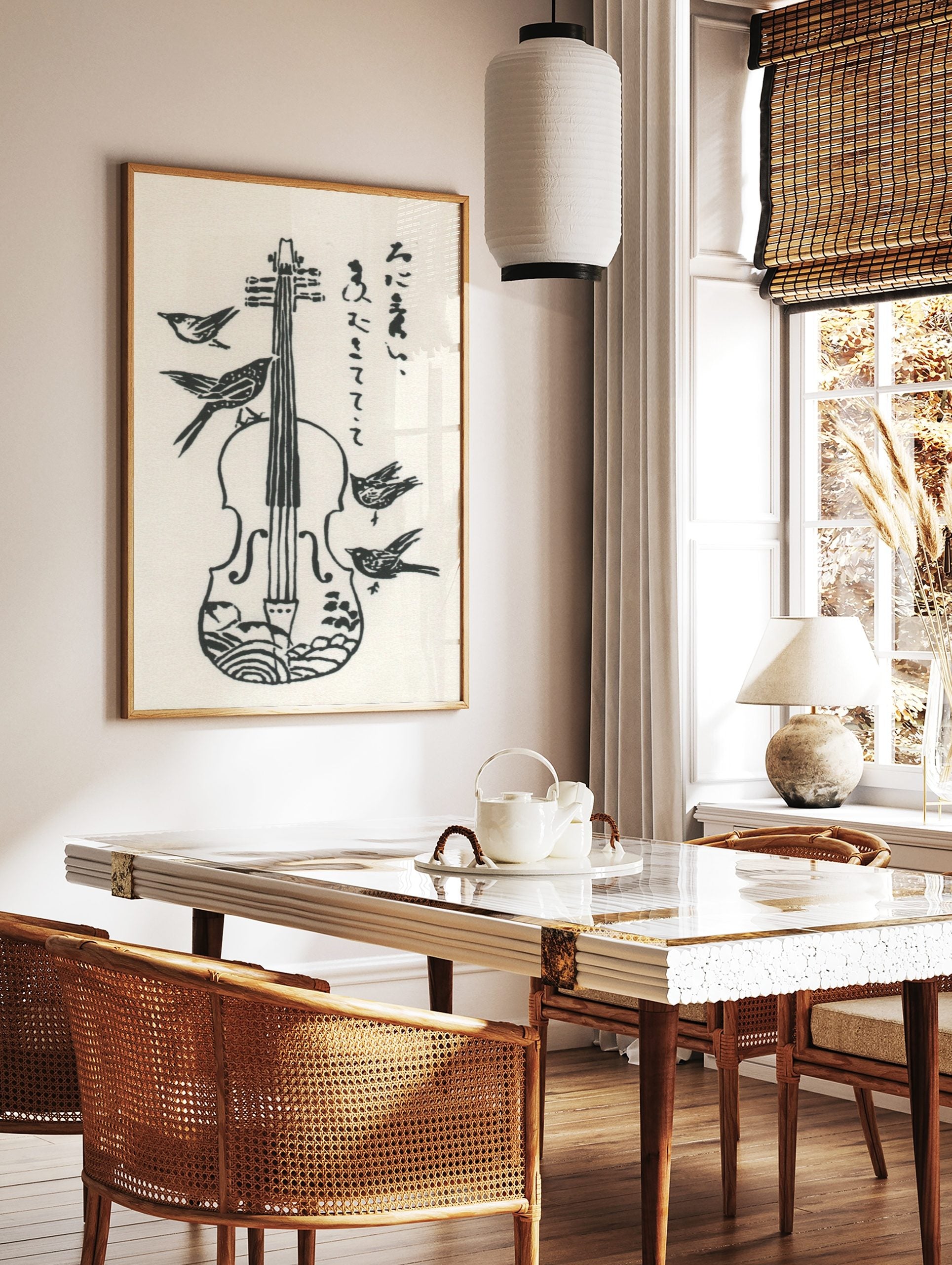 Monochrome woodcut style print of a violin with four birds and vertical Japanese script, in a styled room mockup