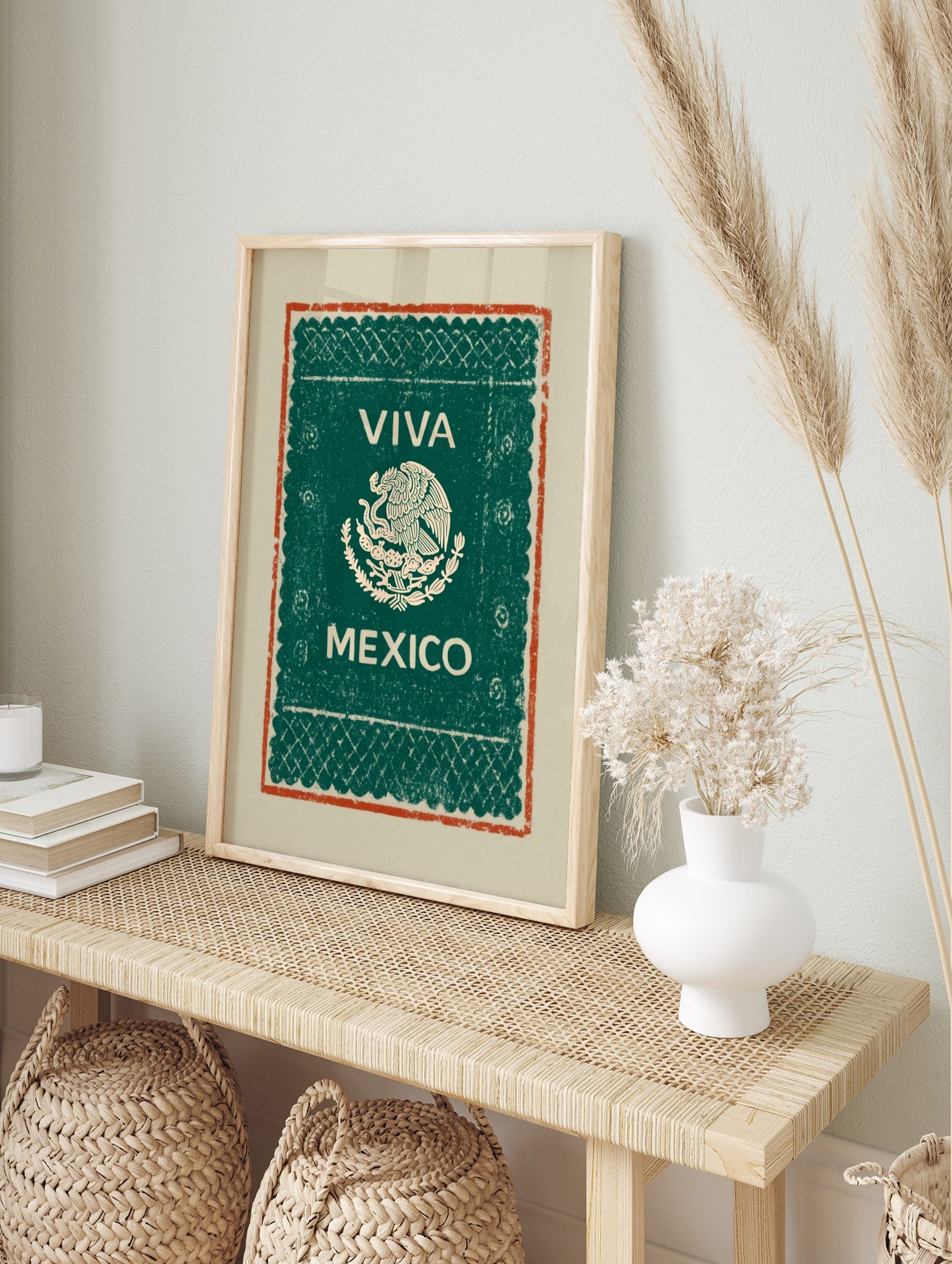 Viva Mexico wall art with eagle and serpent emblem, 'VIVA MEXICO' text, green background, and, in an alternate framed mockup