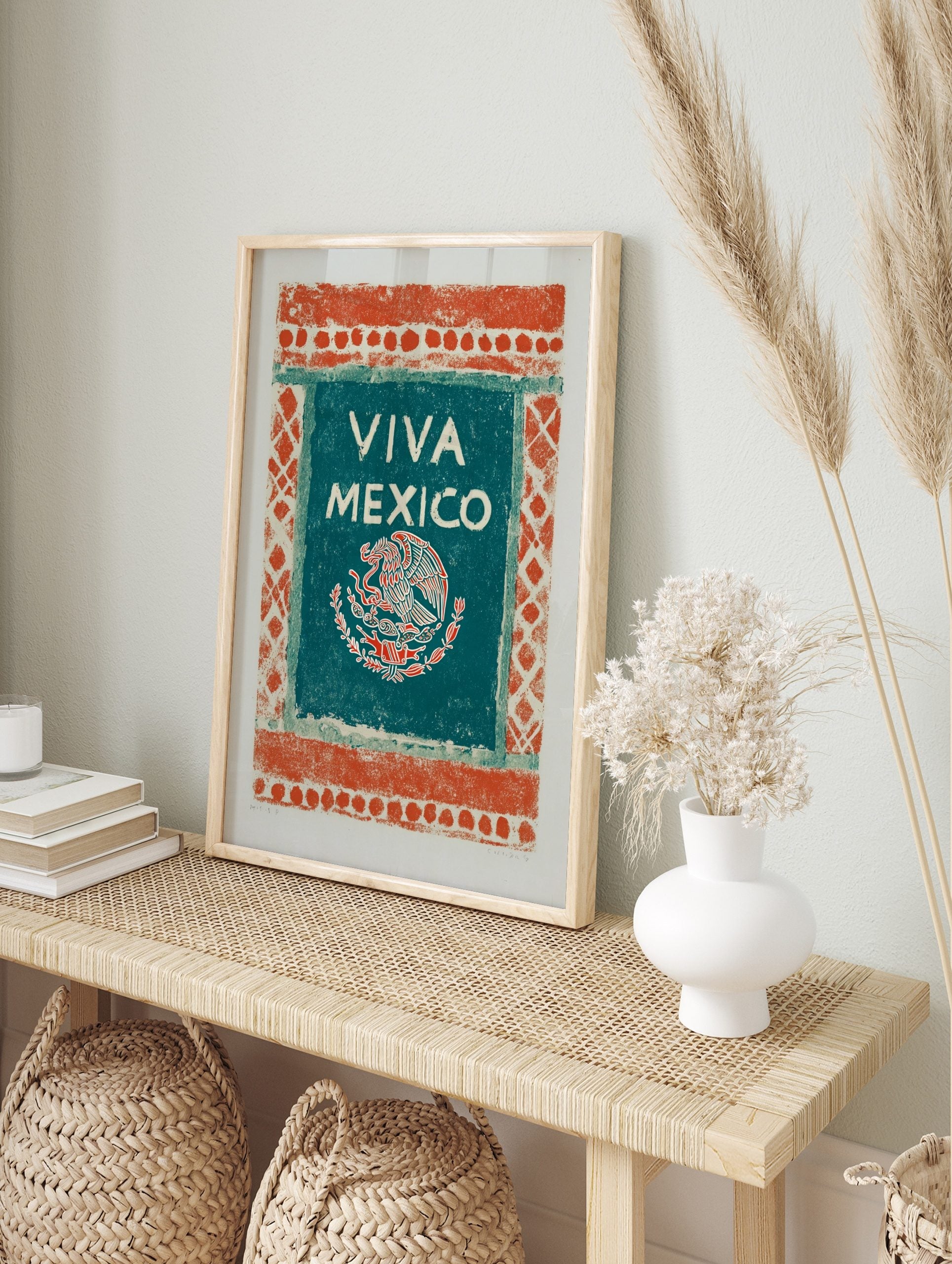 Viva Mexico art print with an eagle, snake, and cactus emblem on a teal-green panel with an, in an alternate framed mockup