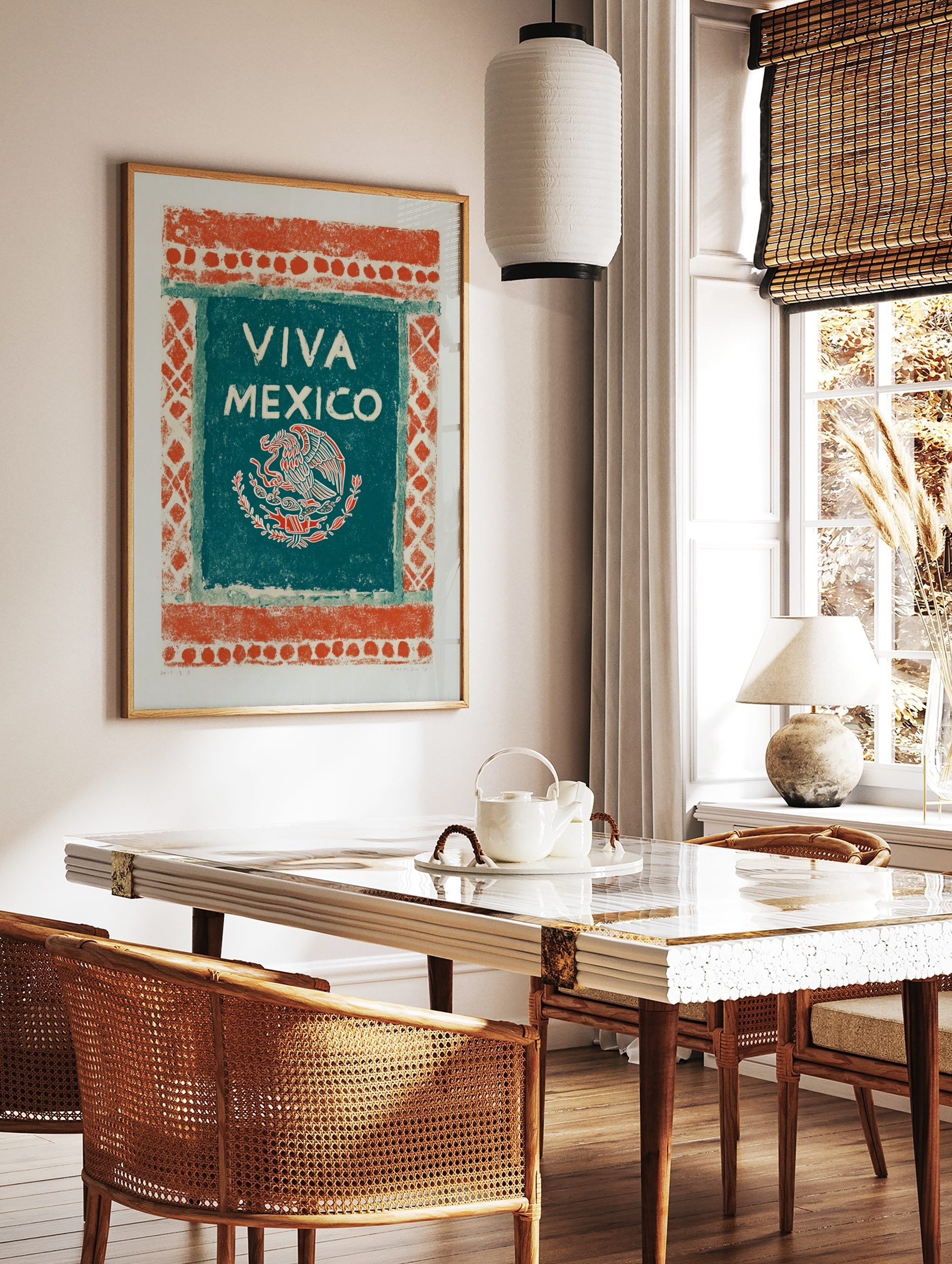 Viva Mexico art print with an eagle, snake, and cactus emblem on a teal-green panel with an, in a styled room mockup