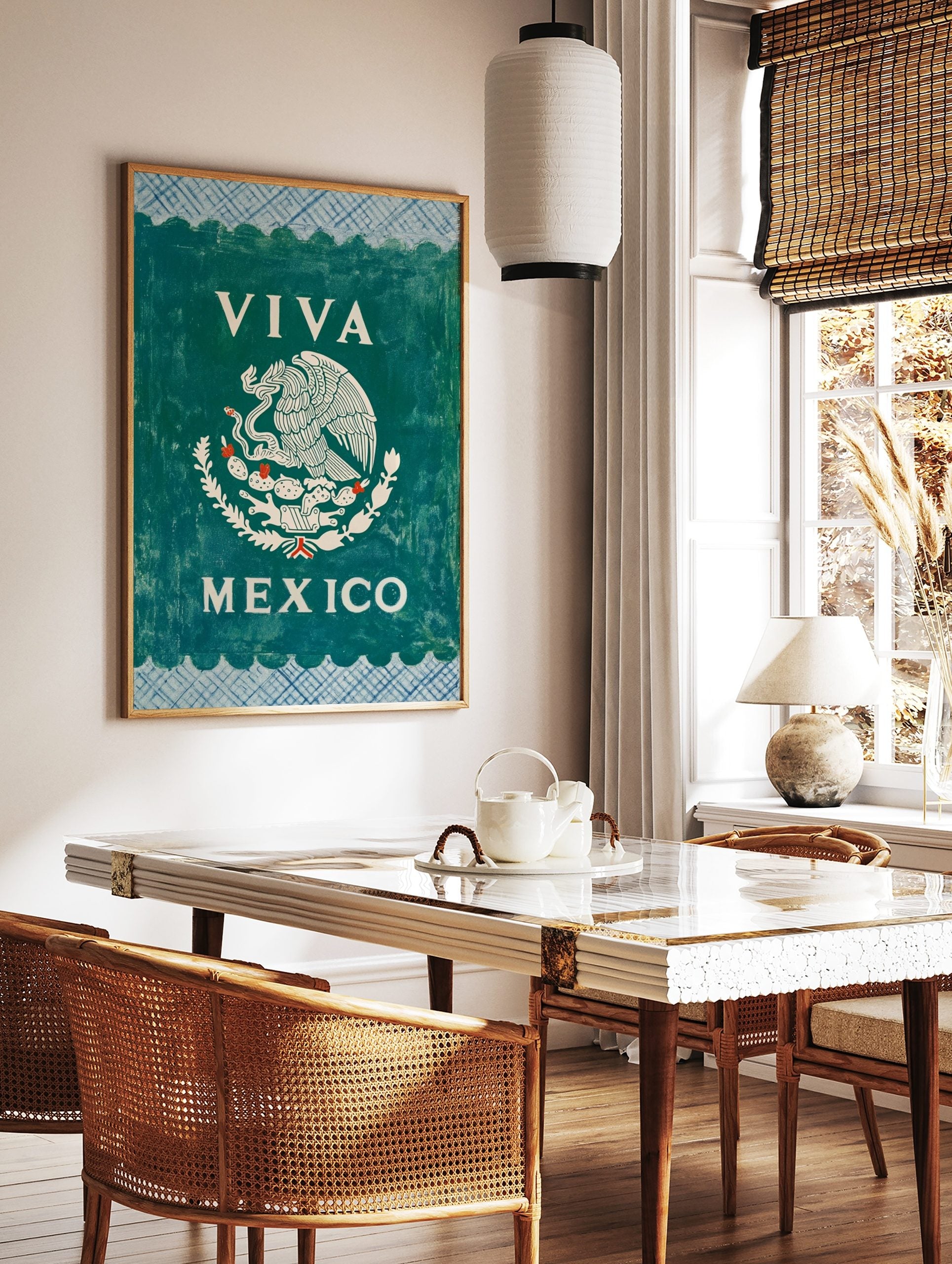 Viva Mexico Wall Art with white Mexican eagle emblem on dark green, blue patterned borders, in a styled room mockup