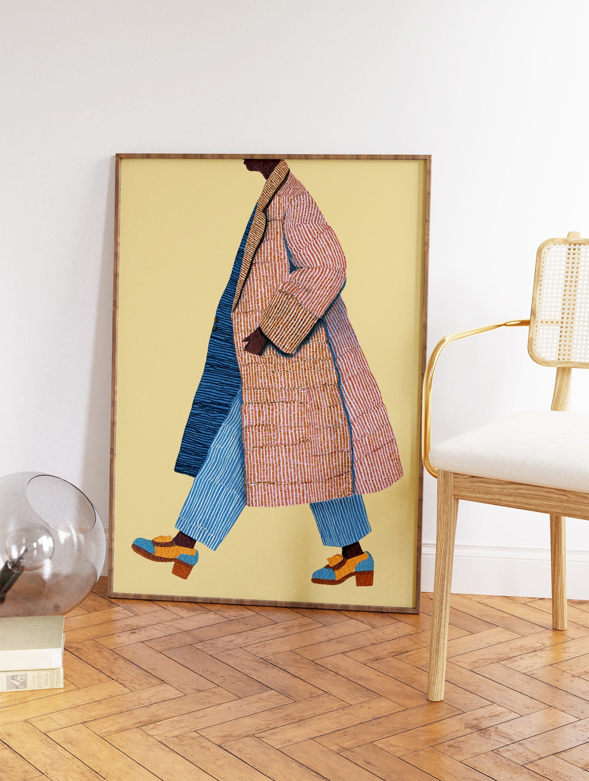 Stylized walking figure wall art illustration of a person in a striped orange and blue coat with blue striped pants. - Image 2