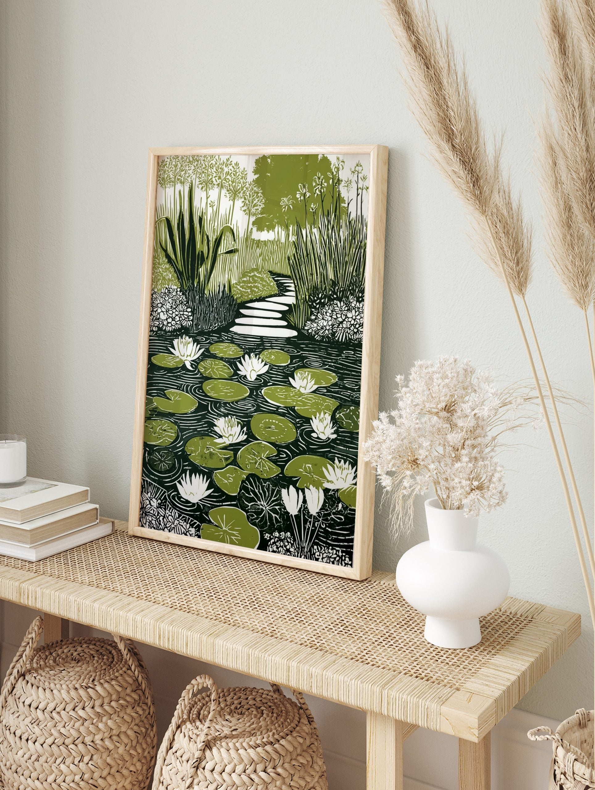 Illustrative green and white water lily pond print with stepping stone path and garden foliage, in an alternate framed mockup