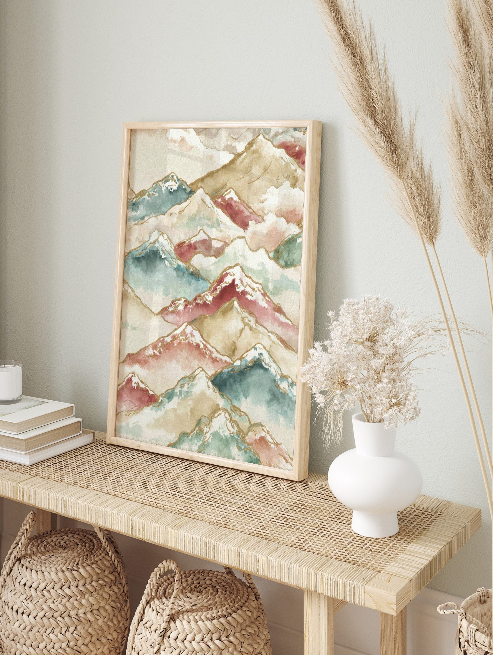 Watercolour mountain range art print with layered peaks in beige, teal, maroon, white, and, in an alternate framed mockup