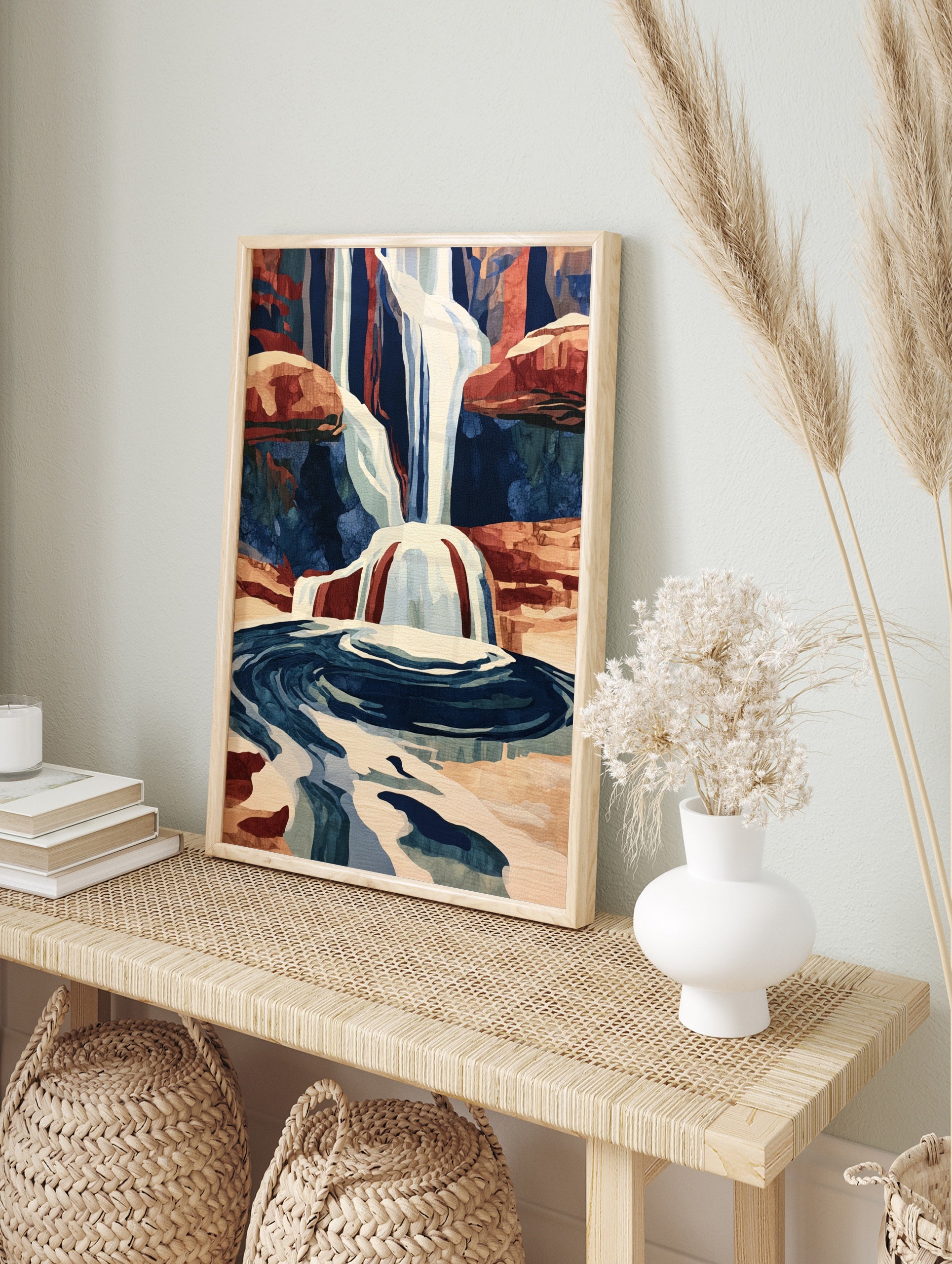 Illustrative waterfall print with cascading water and red rock canyon landscape, blue and, in an alternate framed mockup