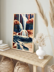 Illustrative waterfall print with cascading water and red rock canyon landscape, blue and, in an alternate framed mockup