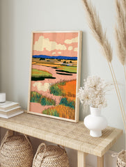 Illustrative wetlands landscape wall art print with peach sky, blue mountains, and vibrant green and orange marsh grasses. - Image 3
