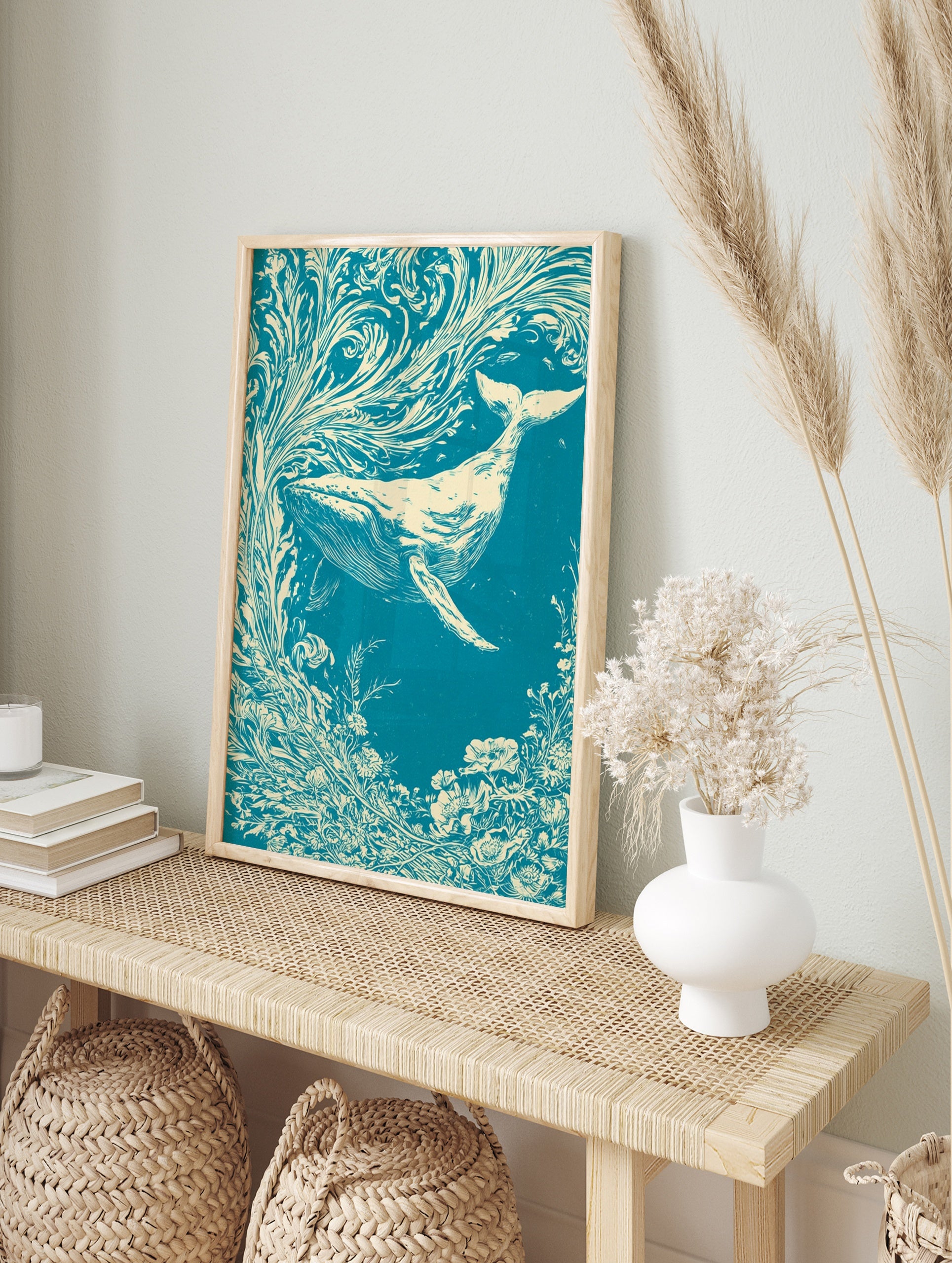 Illustrative whale swimming through swirling floral currents in teal and cream, in an alternate framed mockup