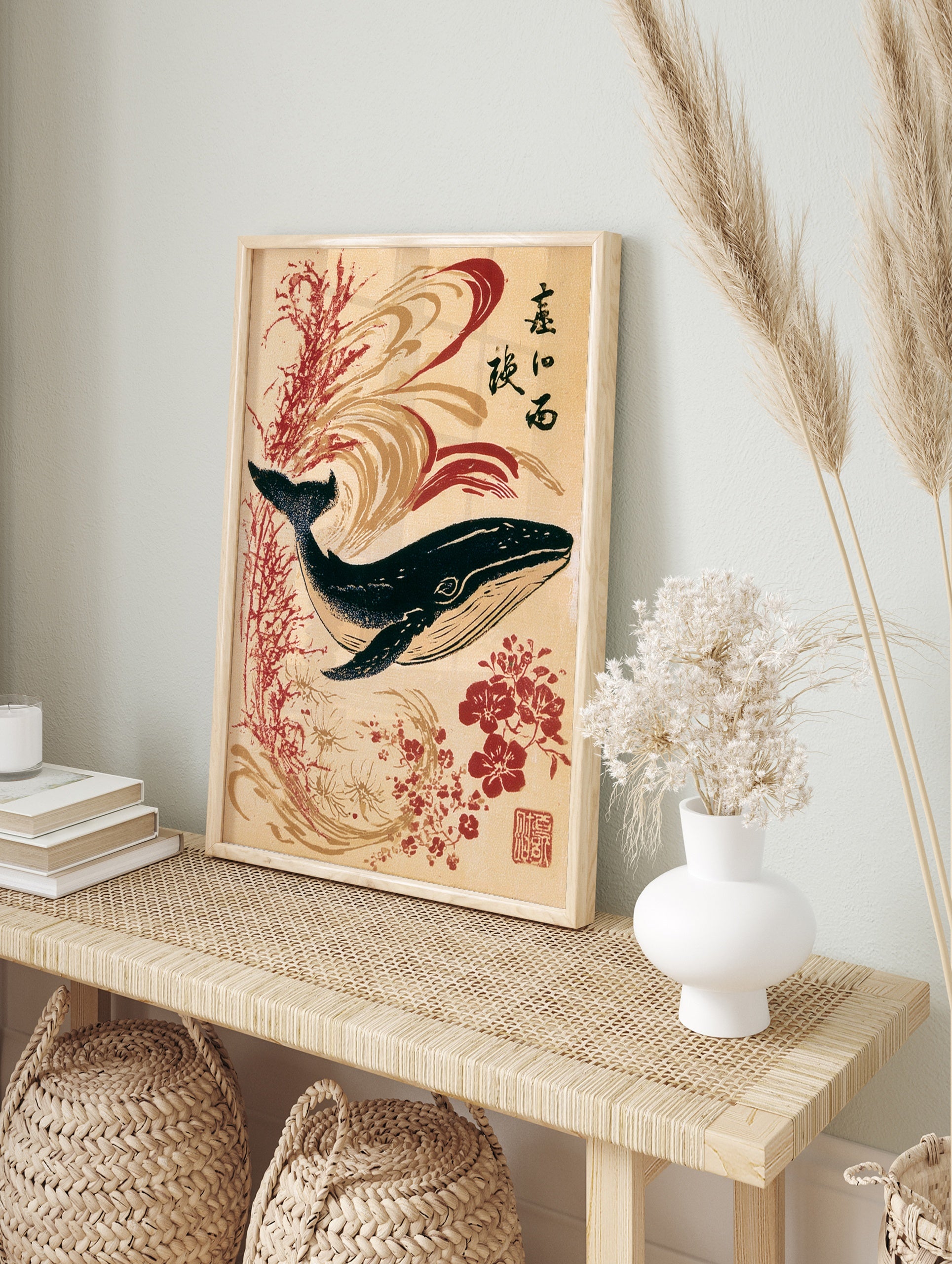 Japanese-style whale art print with red flowers, calligraphy, and swirling wave patterns on a, in an alternate framed mockup