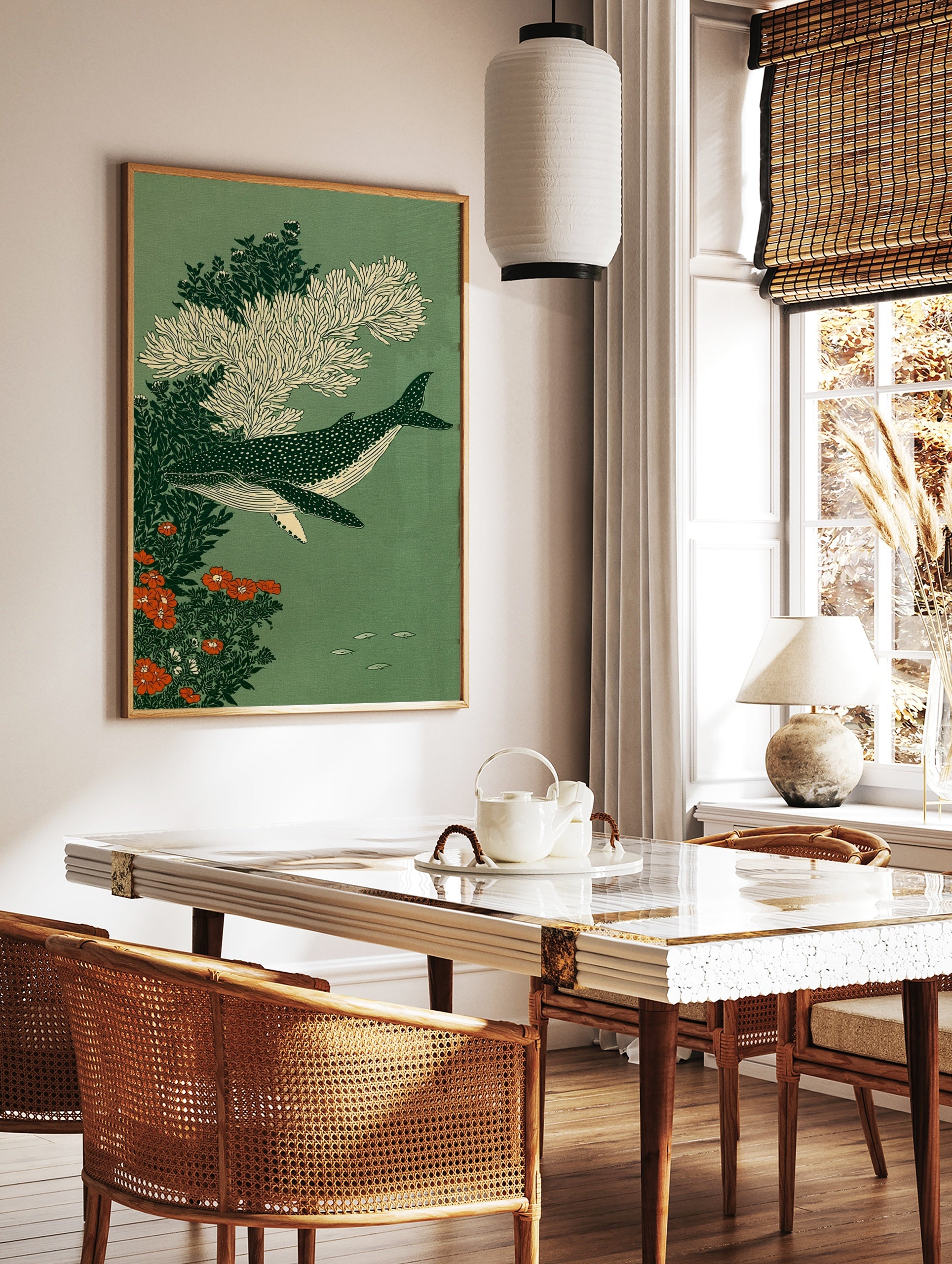 Spotted whale swimming amongst white coral and orange flowers on a green background, illustrative, in a styled room mockup