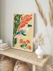 Illustrative whale wall art with green seaweed, red floral motifs, and abstract red shapes on, in an alternate framed mockup