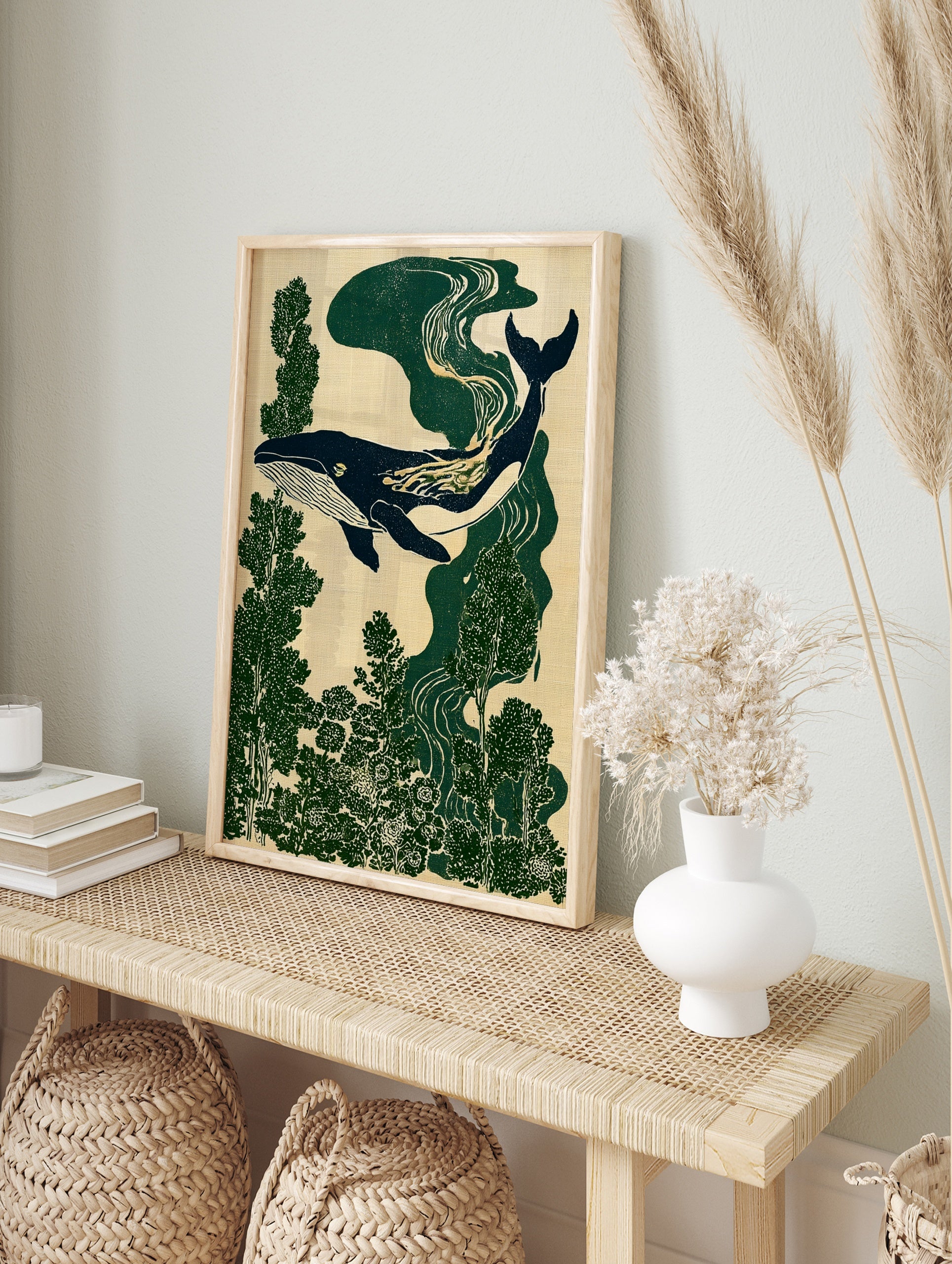 Stylised whale illustration swimming through deep green forest foliage on a neutral textured, in an alternate framed mockup