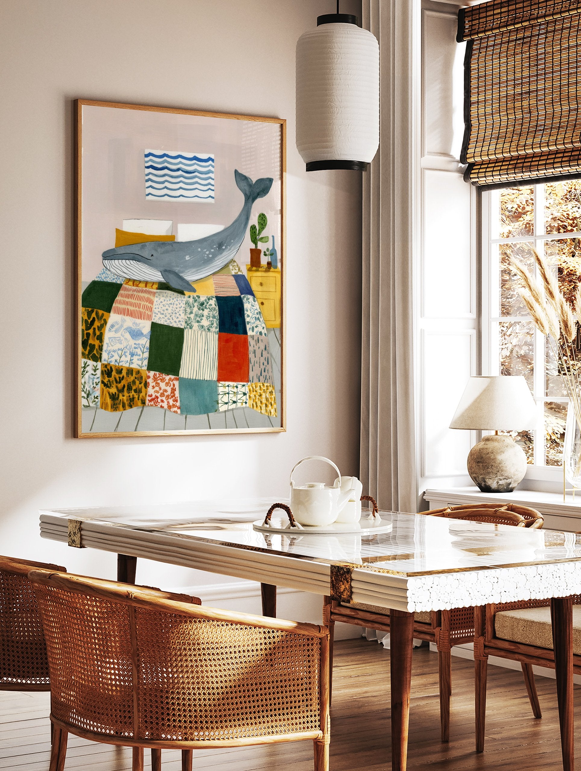 Illustrative whale wall art print showing a blue whale on a colorful patchwork quilt in a bedroom with a yellow nightstand. - Image 2