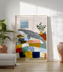 Whimsical whale wall art illustration showing a grey whale sleeping on a colorful patchwork bed in a cozy room. - Image 3