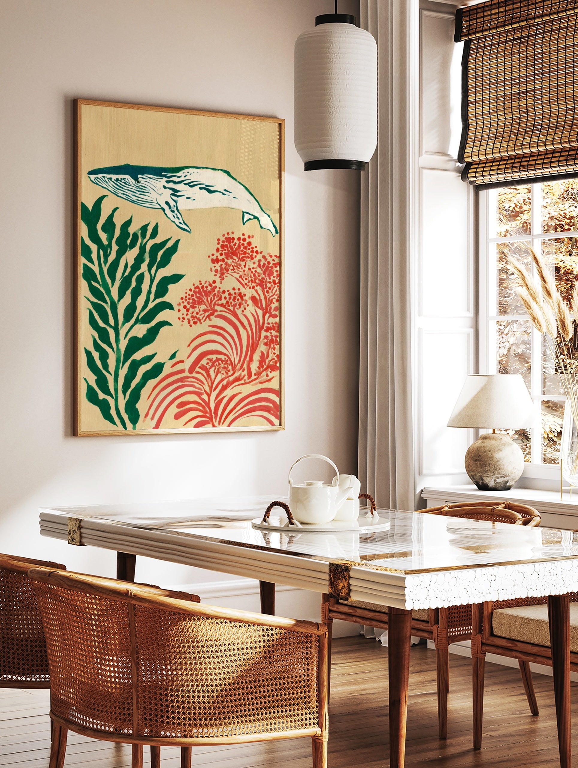 Whale illustration with green seaweed and red coral on a tan background art print, in a styled room mockup