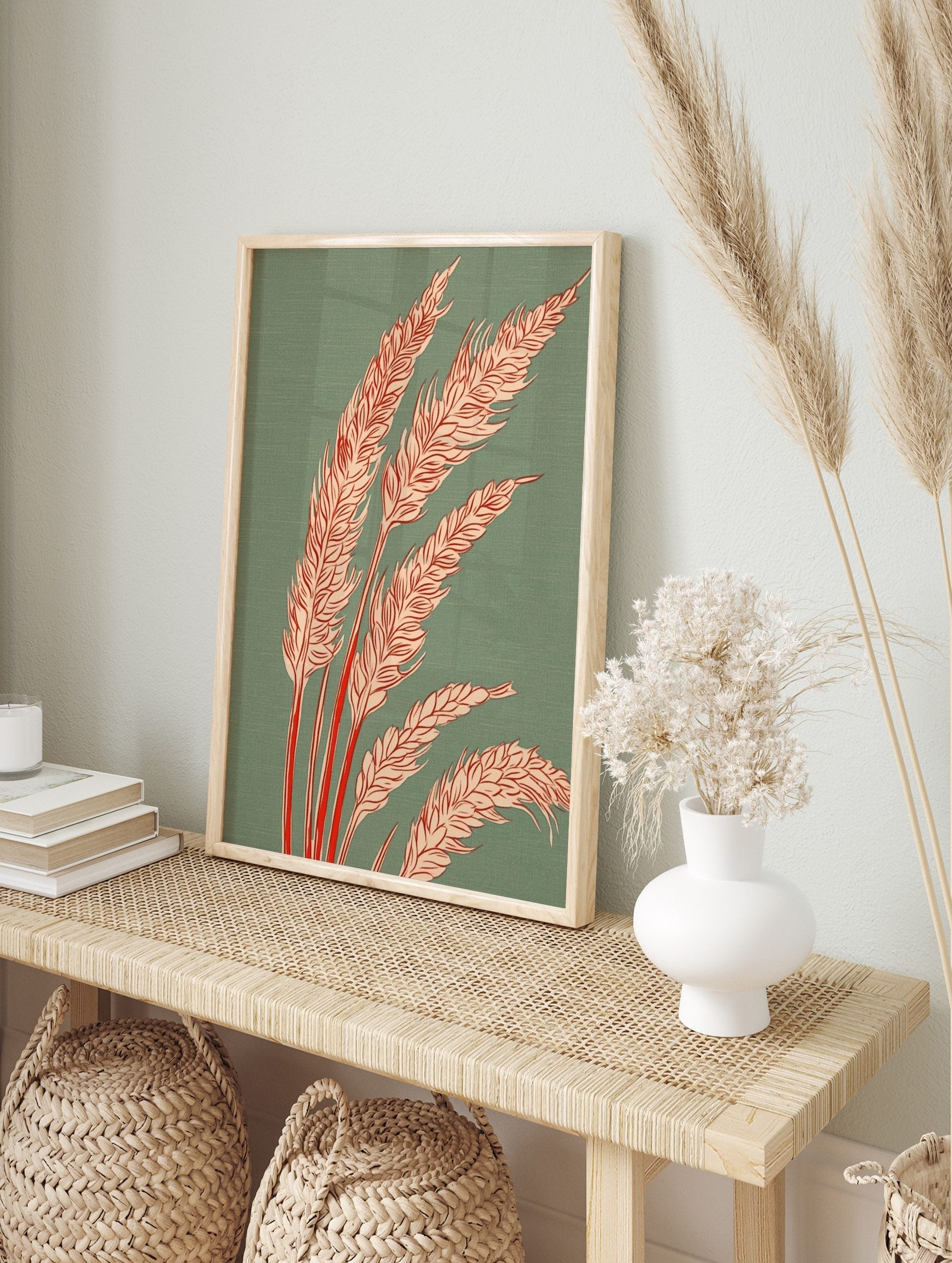 Illustrative wheat stalks with pale orange grain heads and red stems on a teal green, in an alternate framed mockup