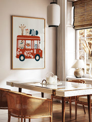 Whimsical illustration of cartoon animals (giraffe, bears, elephant, tiger) riding a red bus with, in a styled room mockup