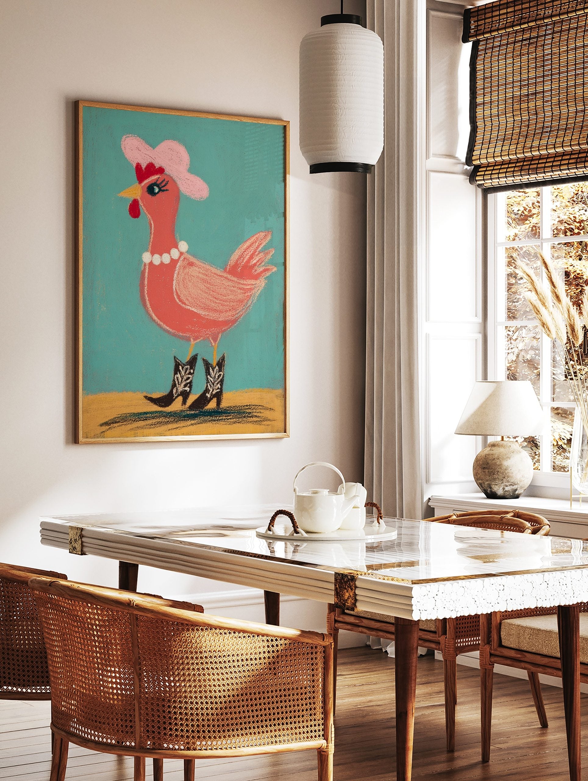 Illustrative chicken wearing pink cowboy hat, pearl necklace, and cowboy boots against teal, in a styled room mockup