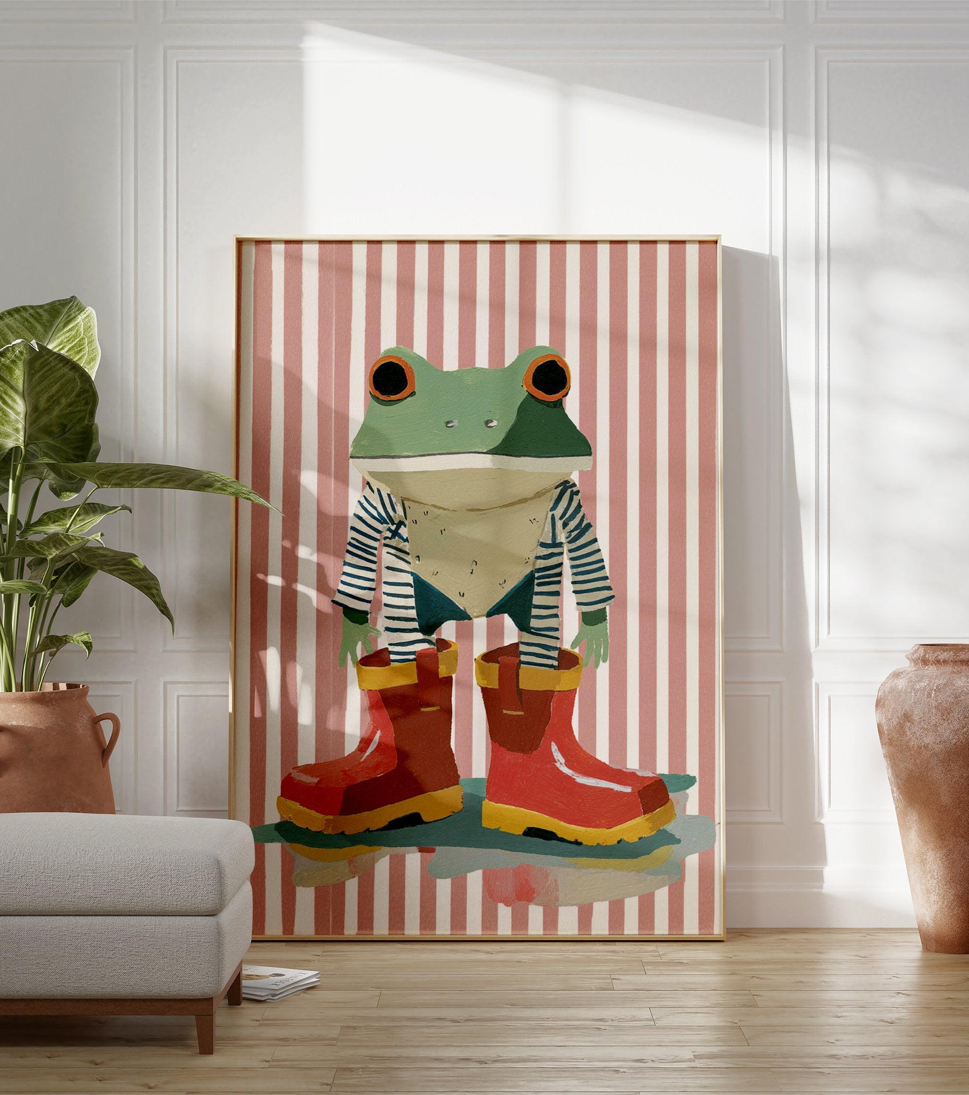 Whimsical frog wall art wearing a striped shirt and red rain boots against a pink and white striped background. - Image 3
