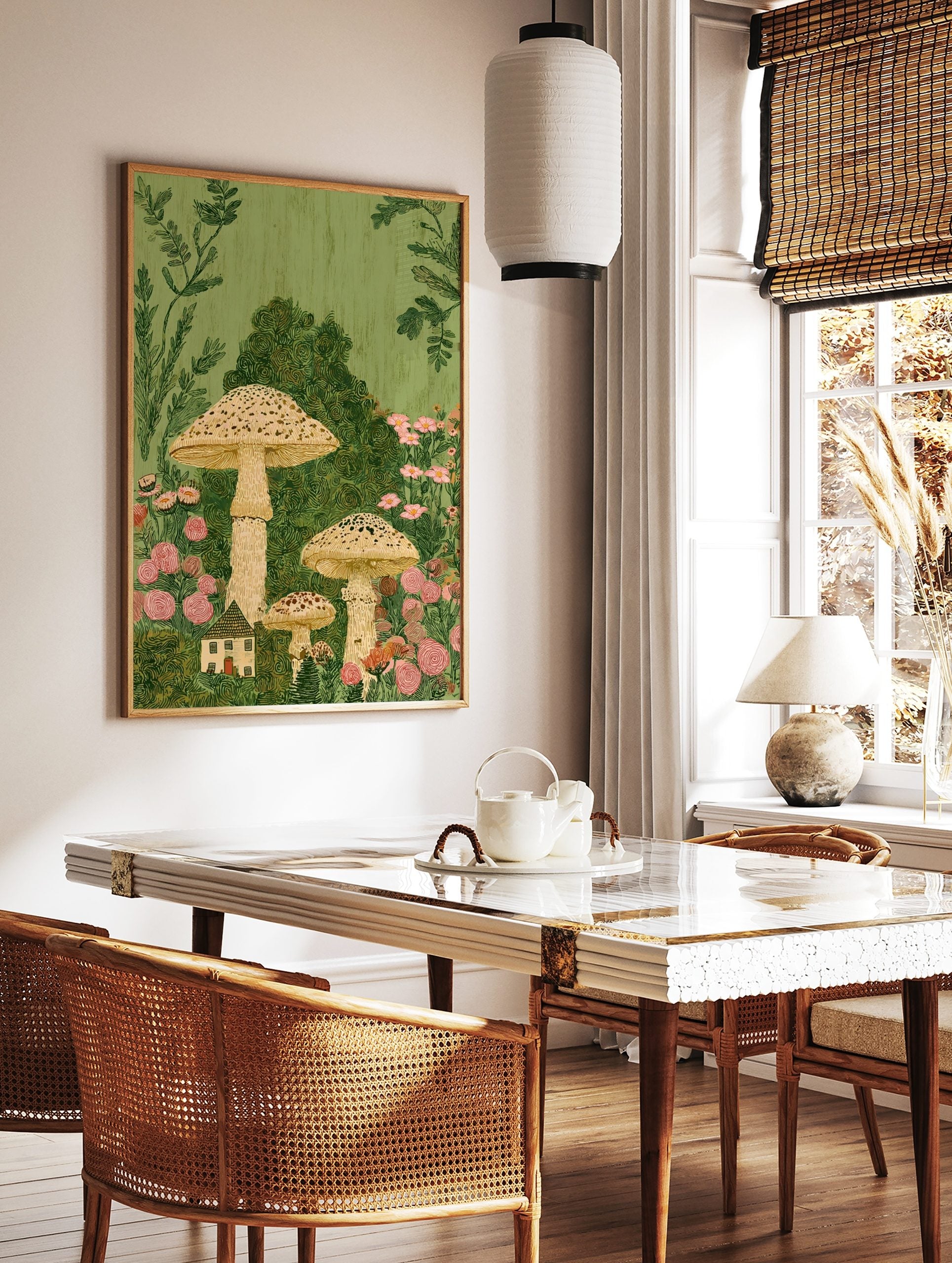 Whimsical illustration of tall speckled mushrooms, a small cottage, and pink flowers in lush green, in a styled room mockup