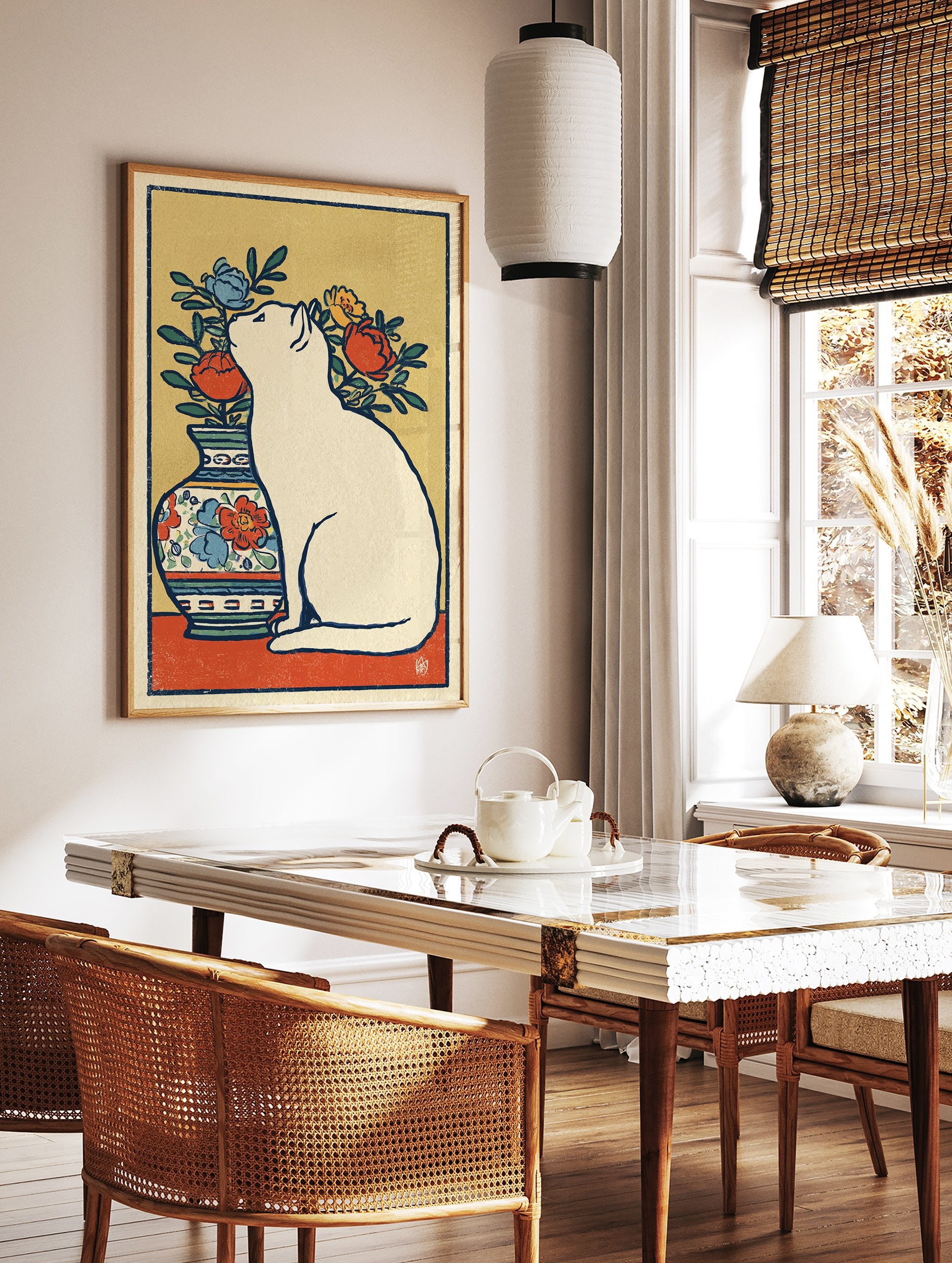 White cat wall art sitting next to a vase with red, blue, and yellow flowers in an illustrated, vintage style. - Image 2