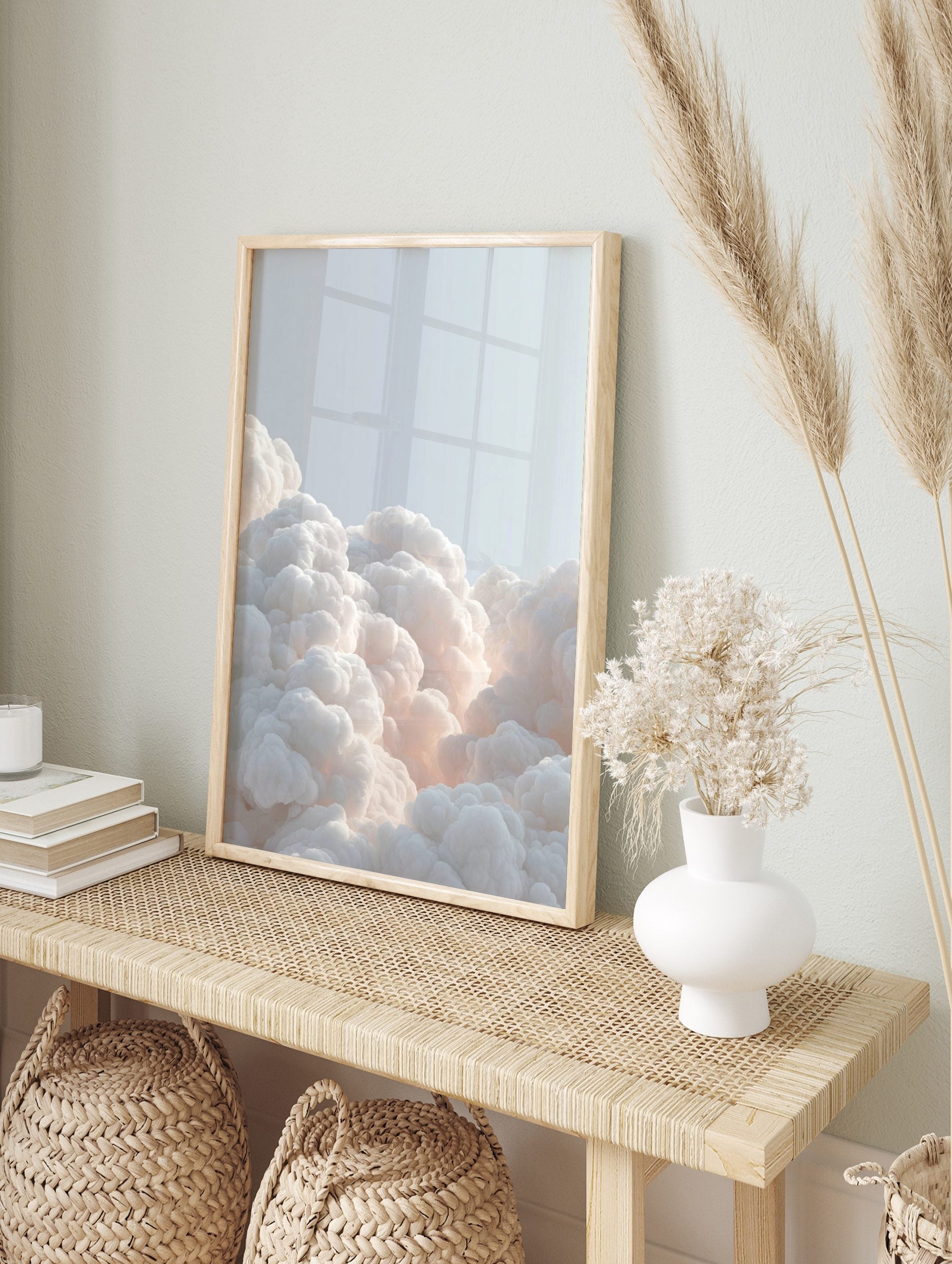 Voluminous white clouds with soft, warm glow against a light blue sky, filling the bottom of, in an alternate framed mockup