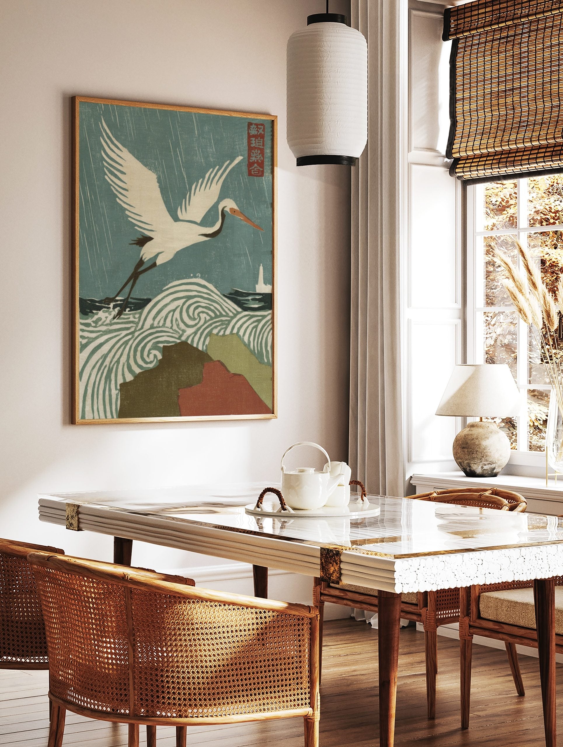 Japanese woodblock print of a white crane flying over swirling stormy waves and rain, with a, in a styled room mockup