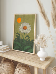 White daisy botanical illustration with orange sun and green leaves against a textured, in an alternate framed mockup