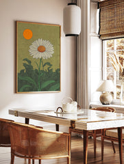 White daisy botanical illustration with orange sun and green leaves against a textured olive-green, in a styled room mockup