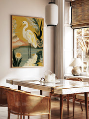 Illustrative white egret bird with yellow feathers standing in water against a yellow background, in a styled room mockup