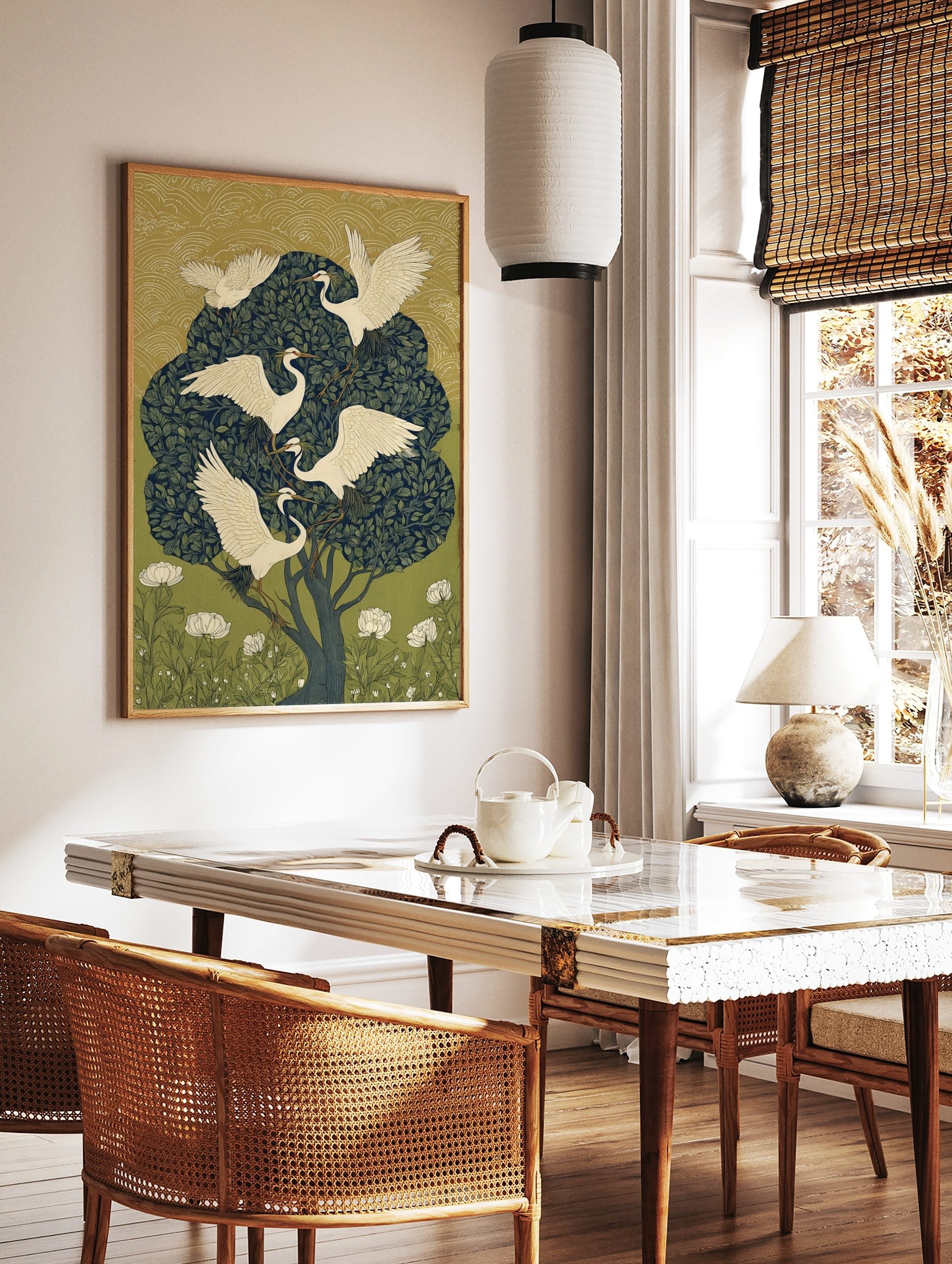 Illustrative art print of five white egrets with leafy branches in a dark green tree, with gold, in a styled room mockup