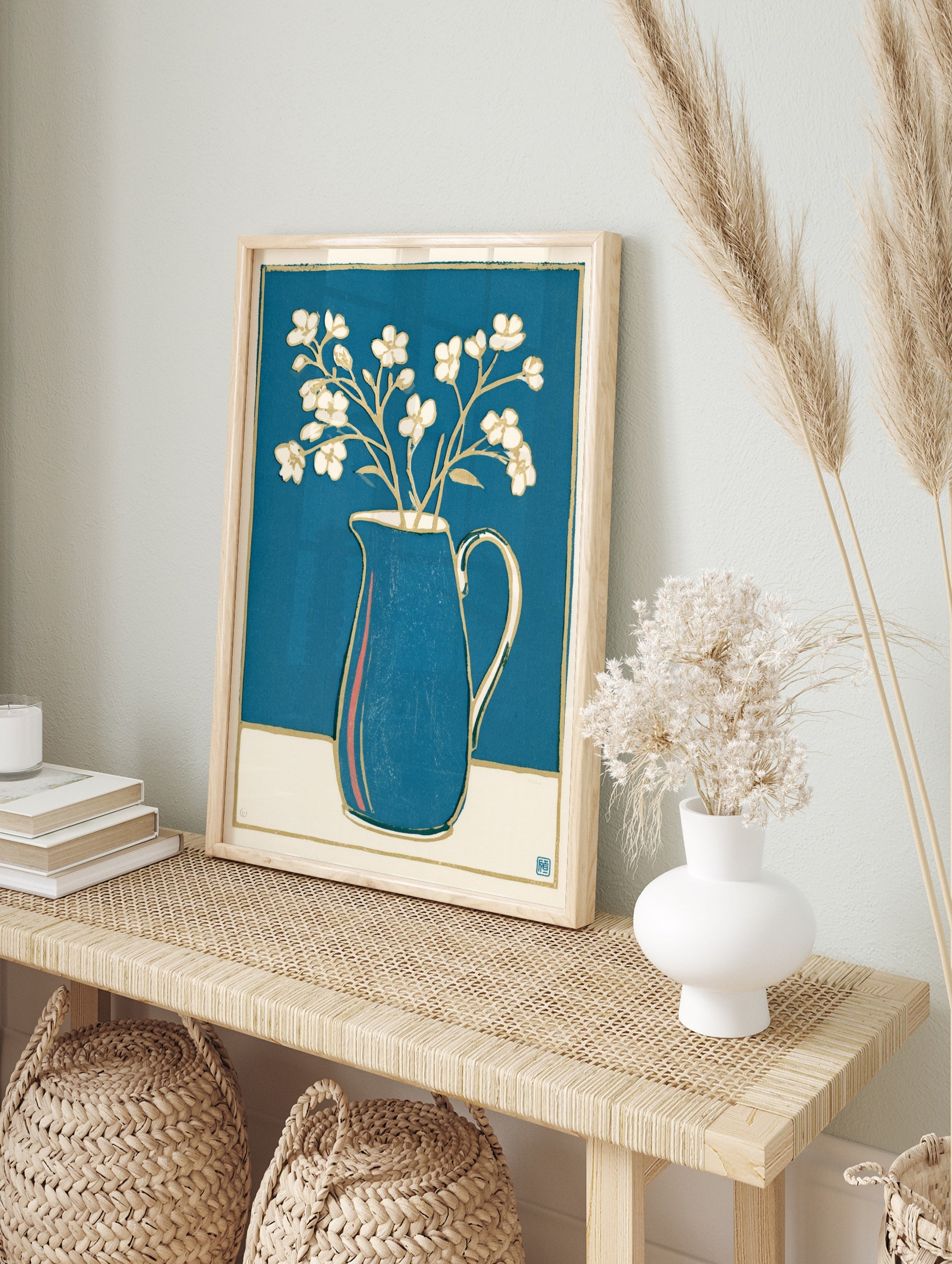 White flowers in a blue pitcher with gold outlines, a minimalist botanical illustration print, in an alternate framed mockup