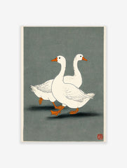 Illustrative print of two white geese with orange beaks and feet walking on a dark grey-green background