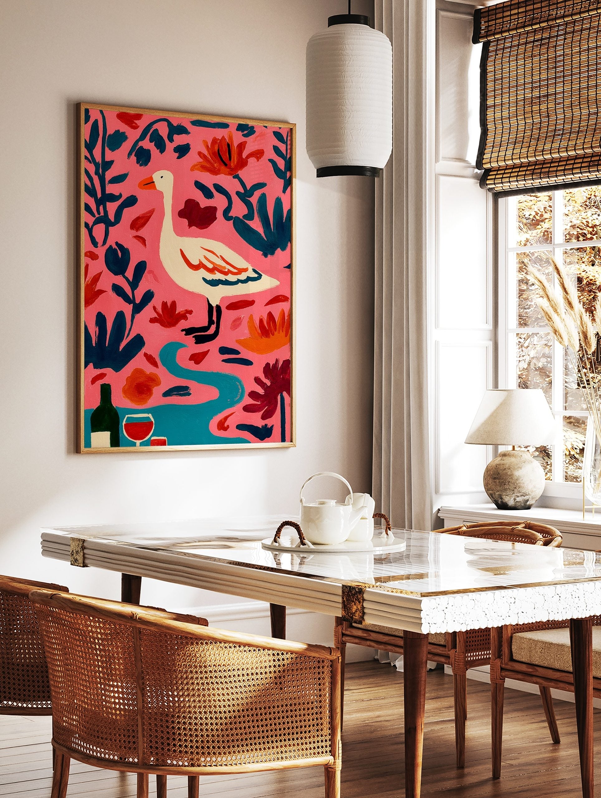 Illustrative white goose with orange beak, pink background, dark teal leaves, orange flowers, wine, in a styled room mockup