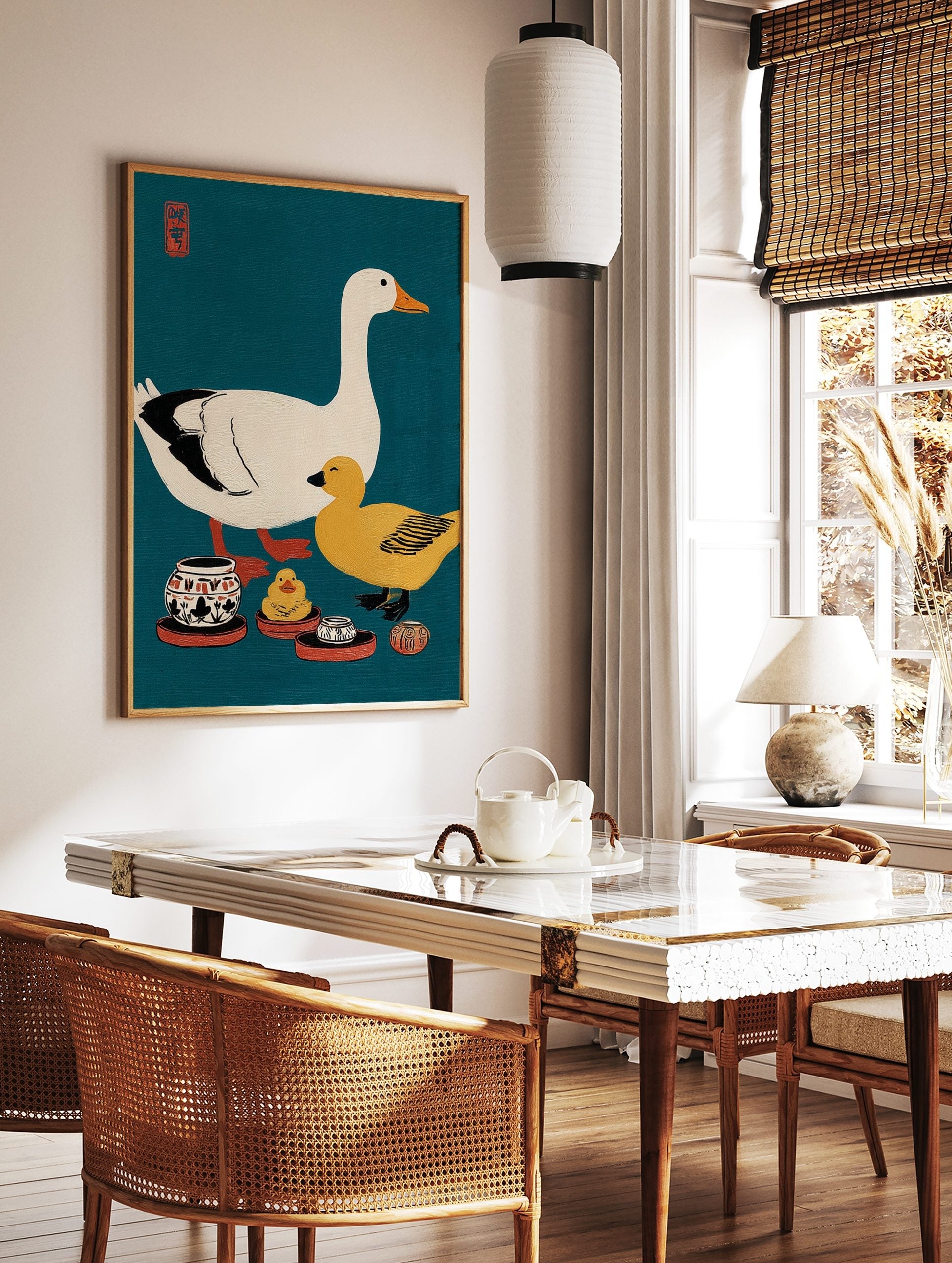 Illustrative print of a white goose, yellow duck, and ceramic pots on a teal background with a red, in a styled room mockup