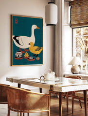 Illustrative print of a white goose, yellow duck, and ceramic pots on a teal background with a red, in a styled room mockup