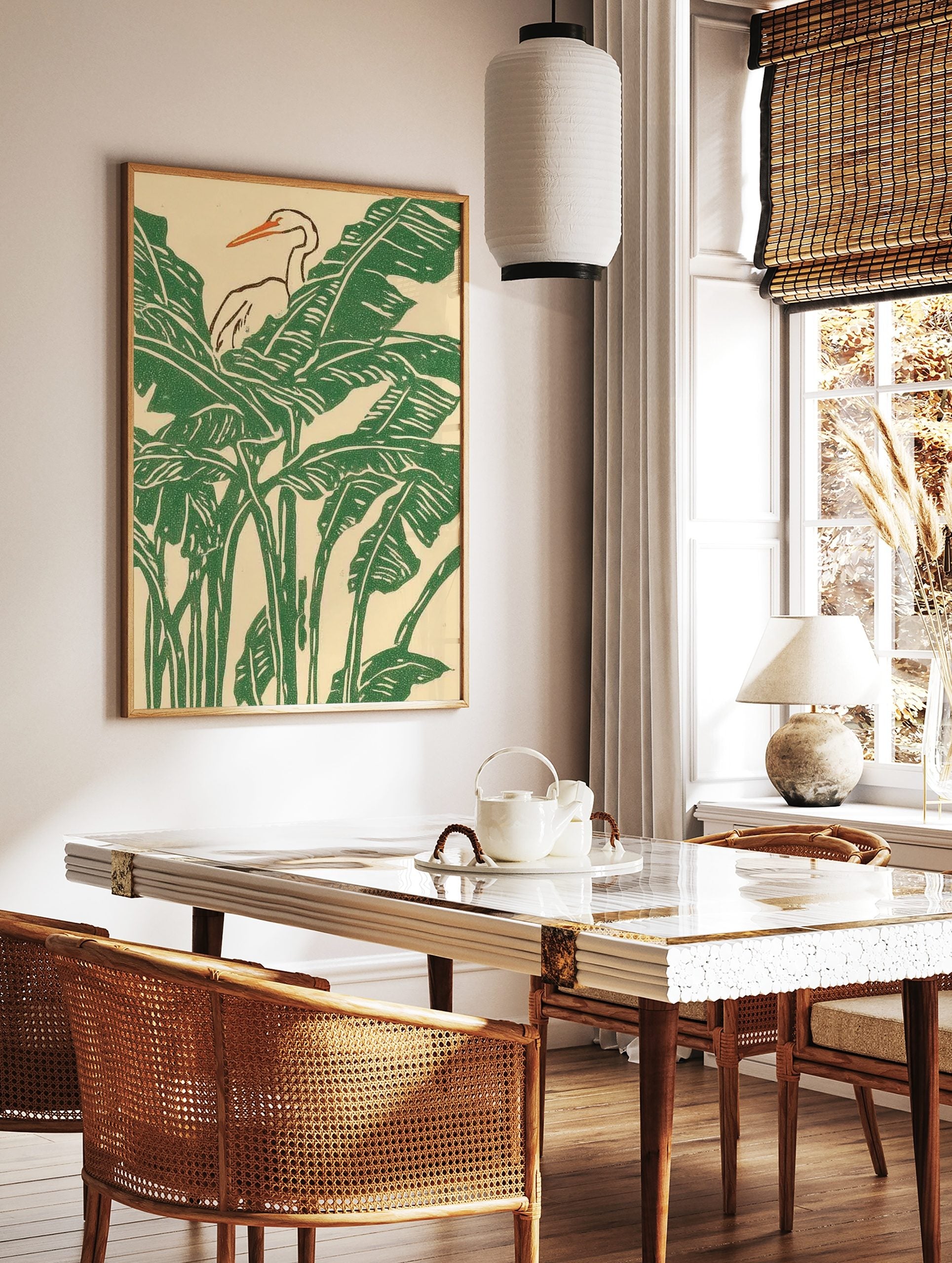 White heron with orange beak amidst green tropical banana leaves in an illustrative print, in a styled room mockup