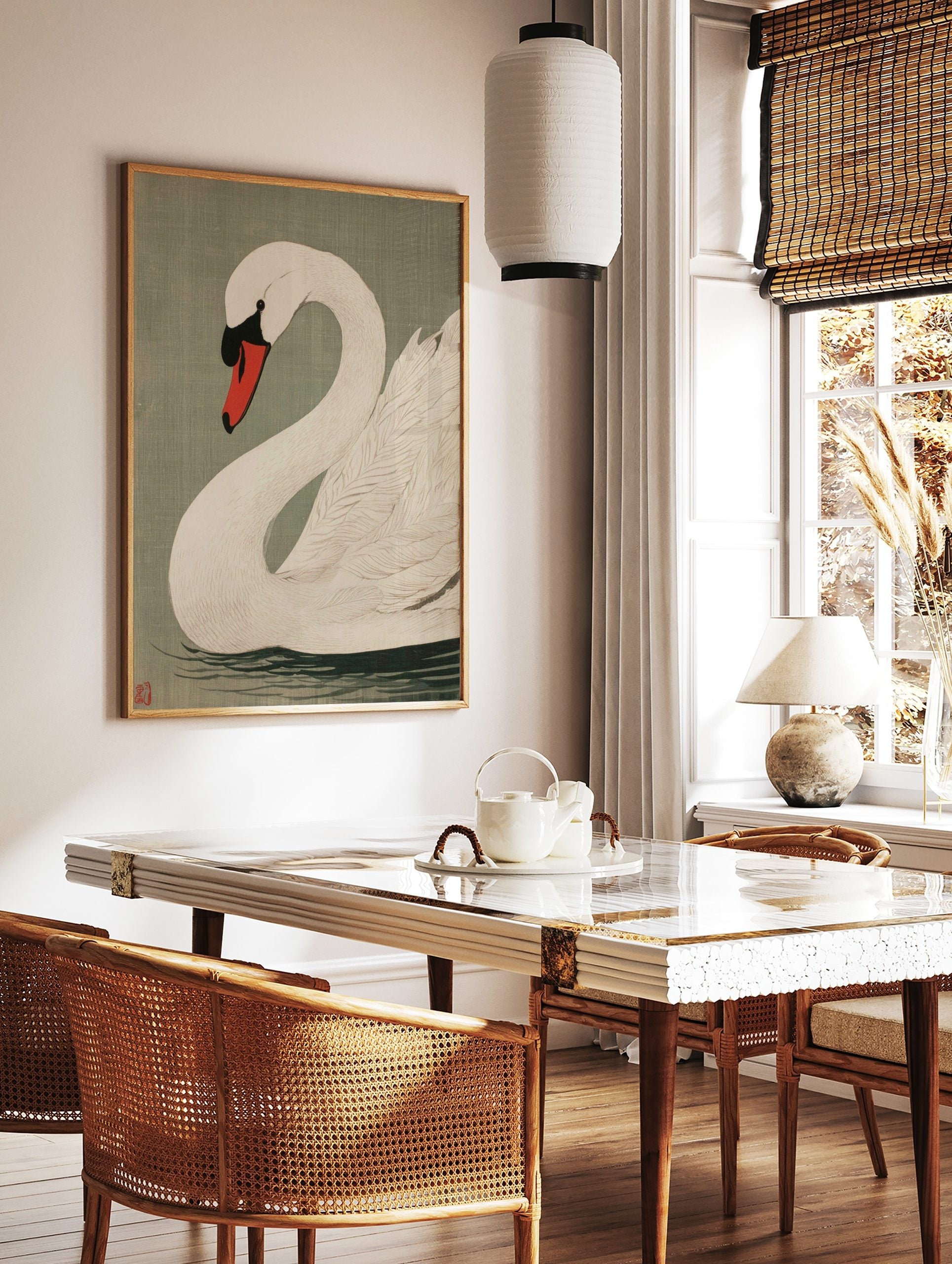 White swan woodblock style art print with red and black beak, on sage green background, in a styled room mockup