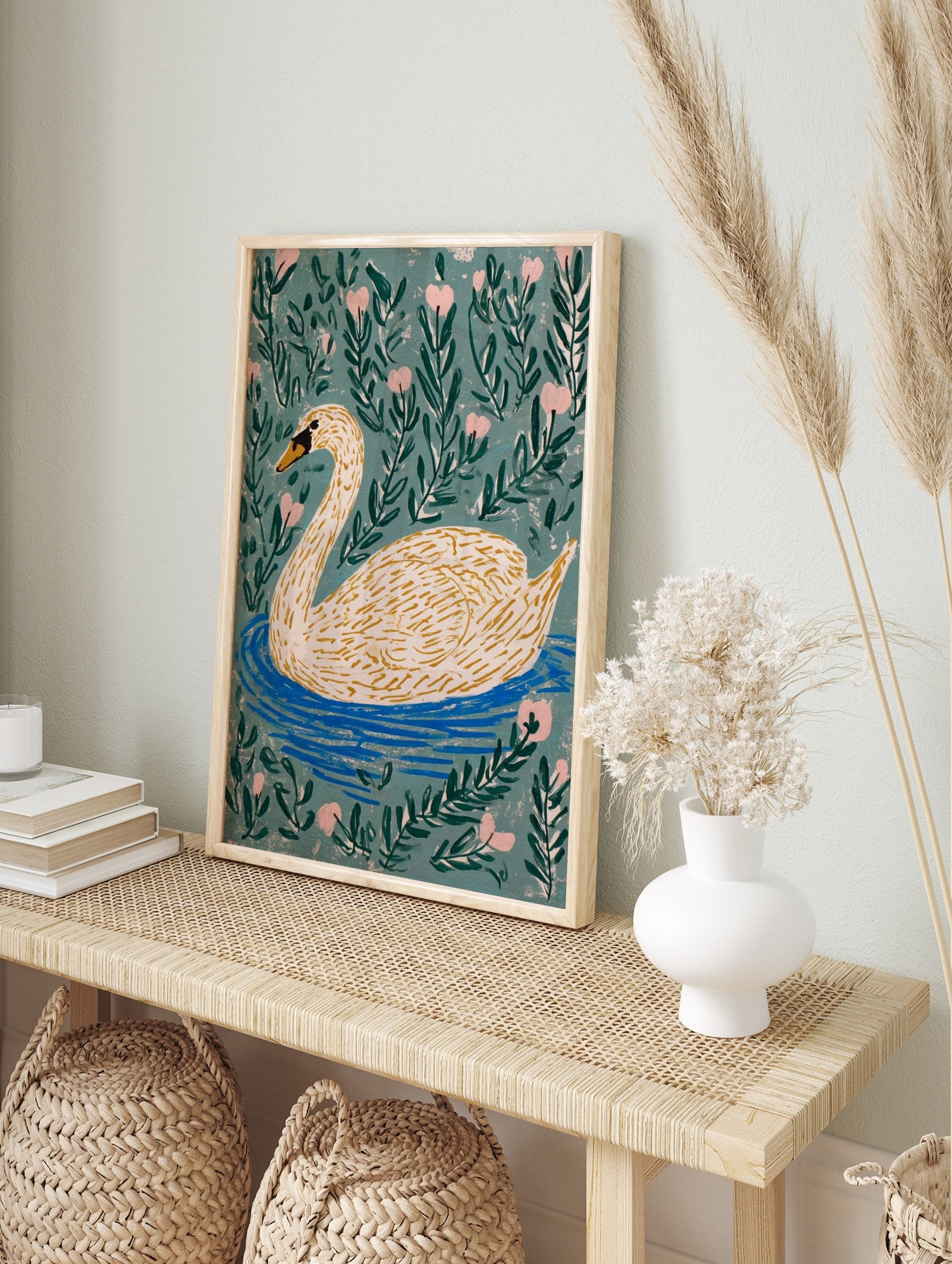 Illustrative white swan with orange beak swimming in blue water, surrounded by green leaves, in an alternate framed mockup