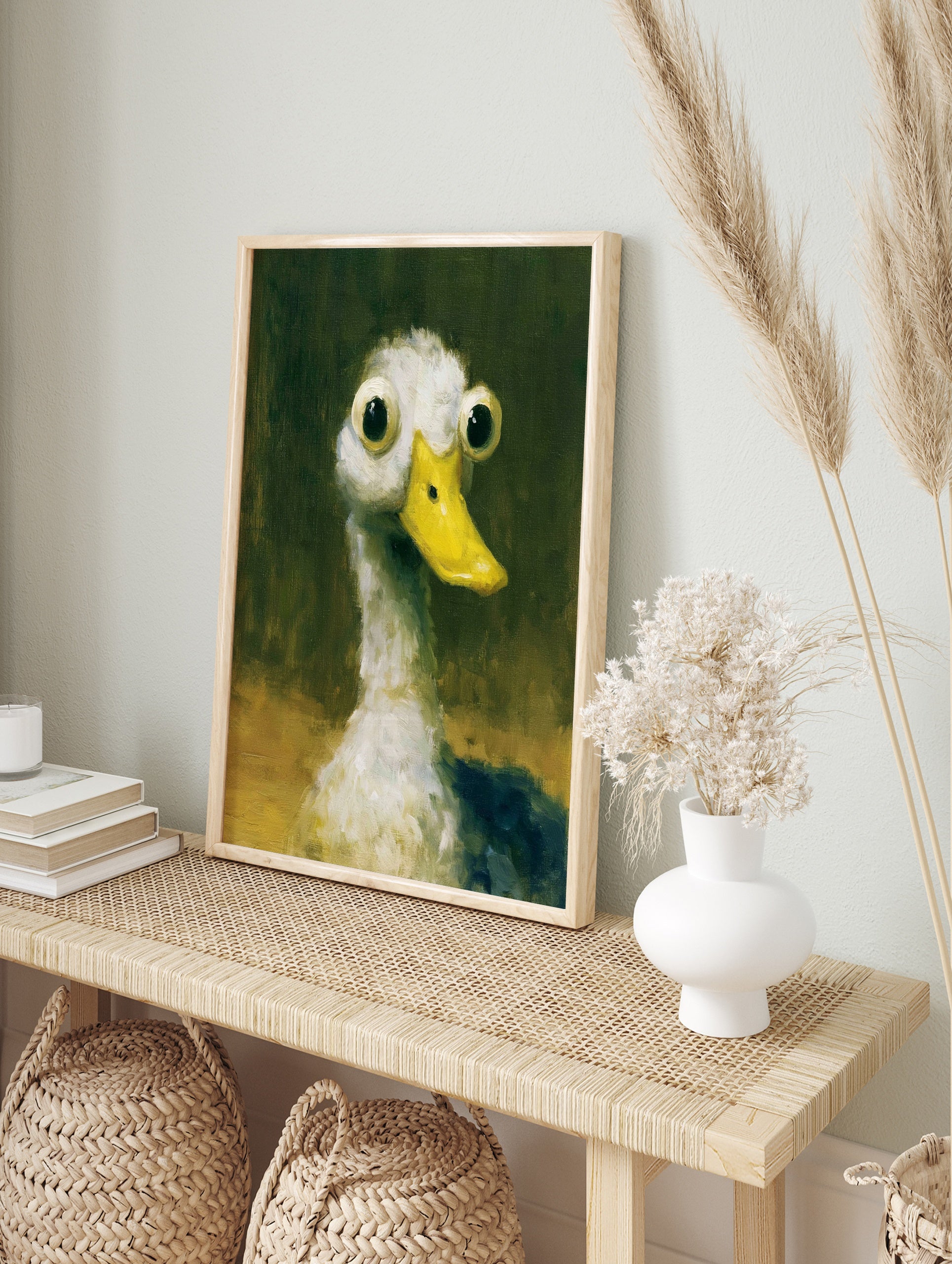 Quirky wide-eyed duck illustration with a yellow bill against a dark green background, art, in an alternate framed mockup