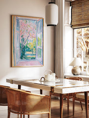 Impressionist Window View Poster showing a vibrant pink blossom tree in a lush green garden with a building in the background. - Image 2